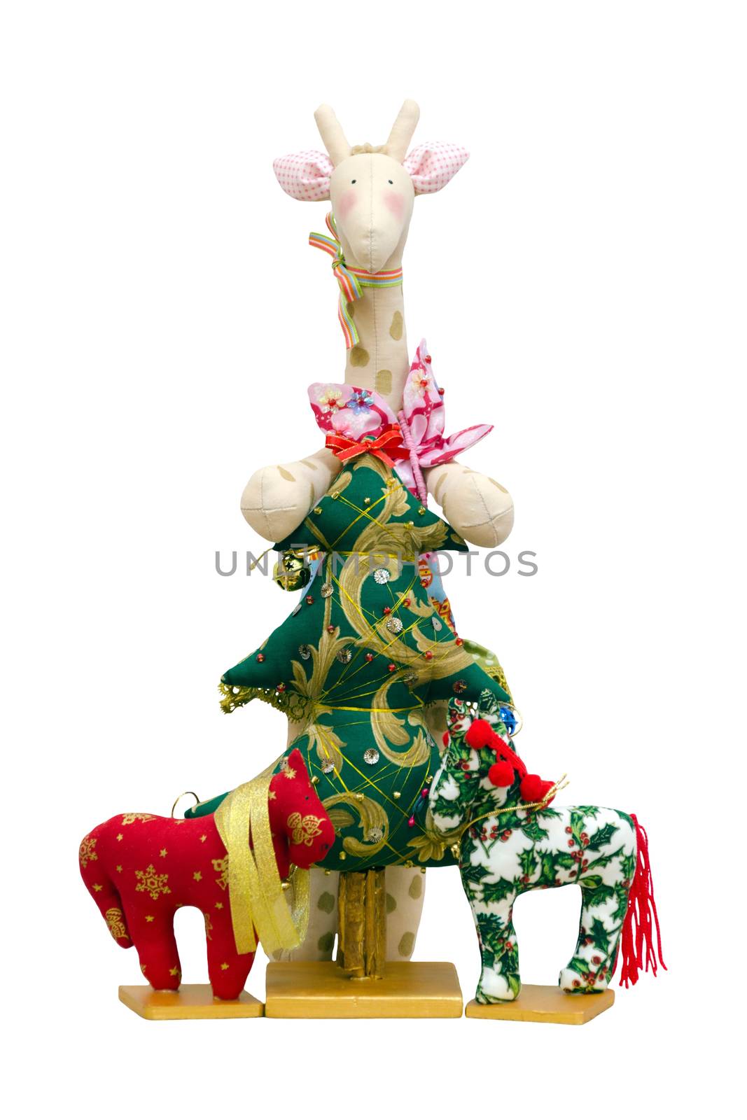 The Handmade soft toy isolated New Year tree and giraffe and two ponys
