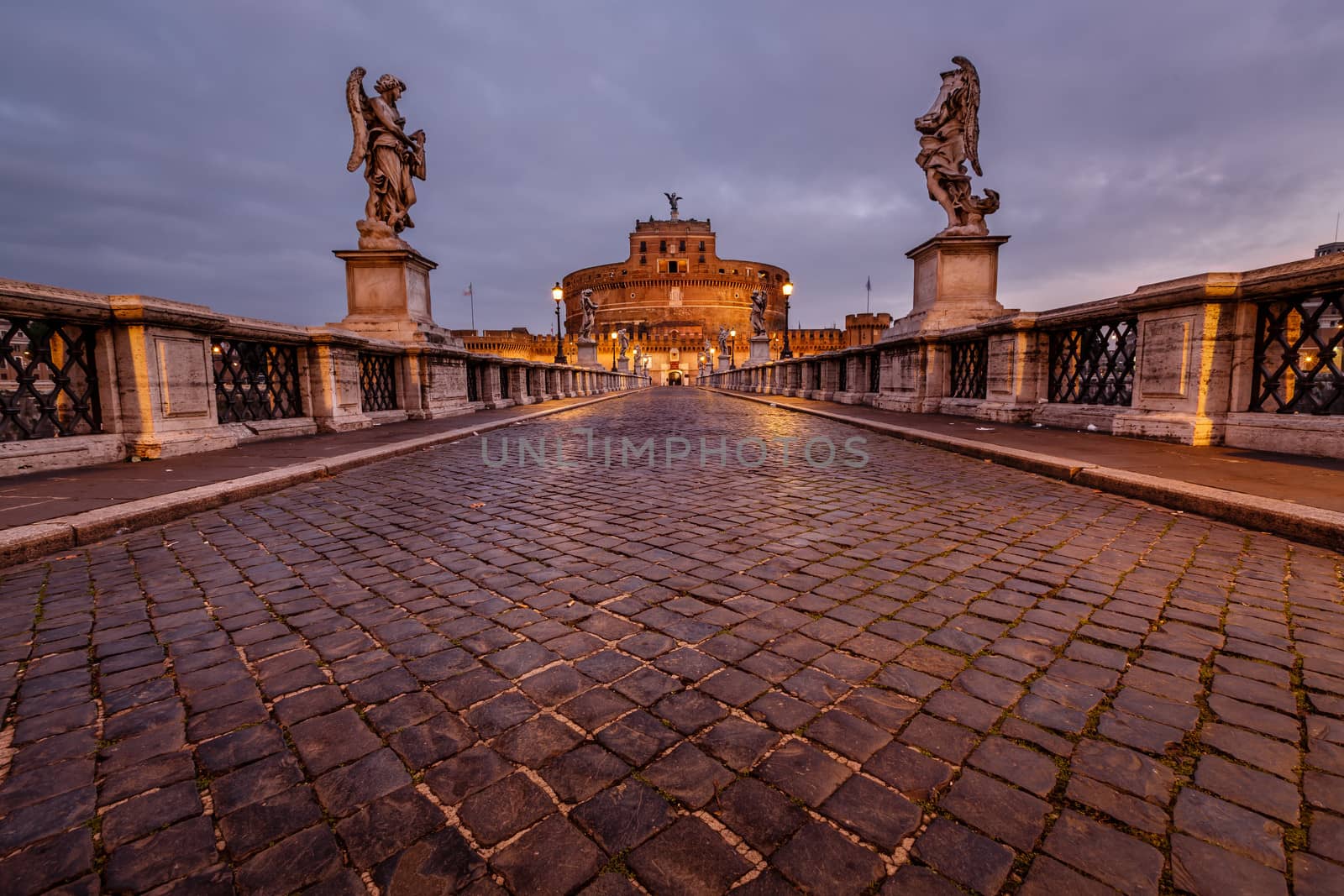 Castle of Holy Angel and Holy Angel Bridge over the Tiber River in Rome at Dawn, Italy