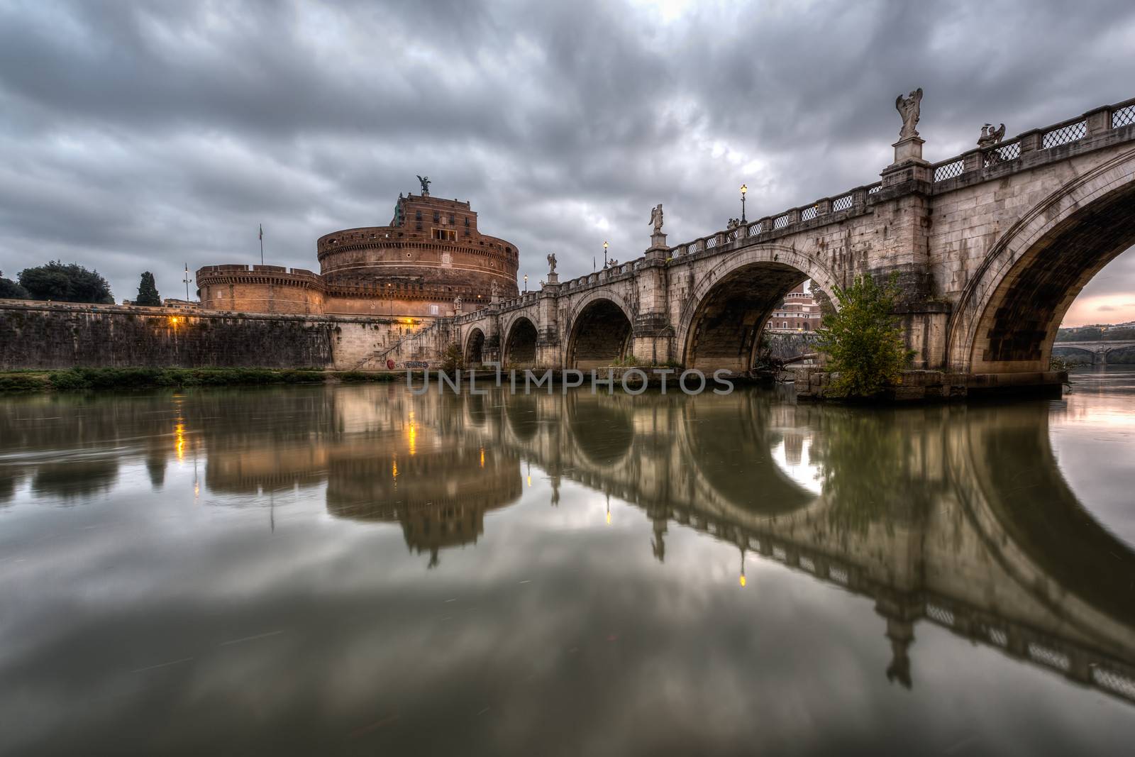 Castle of Holy Angel and Holy Angel Bridge over the Tiber River in Rome at Dawn, Italy - HDR version