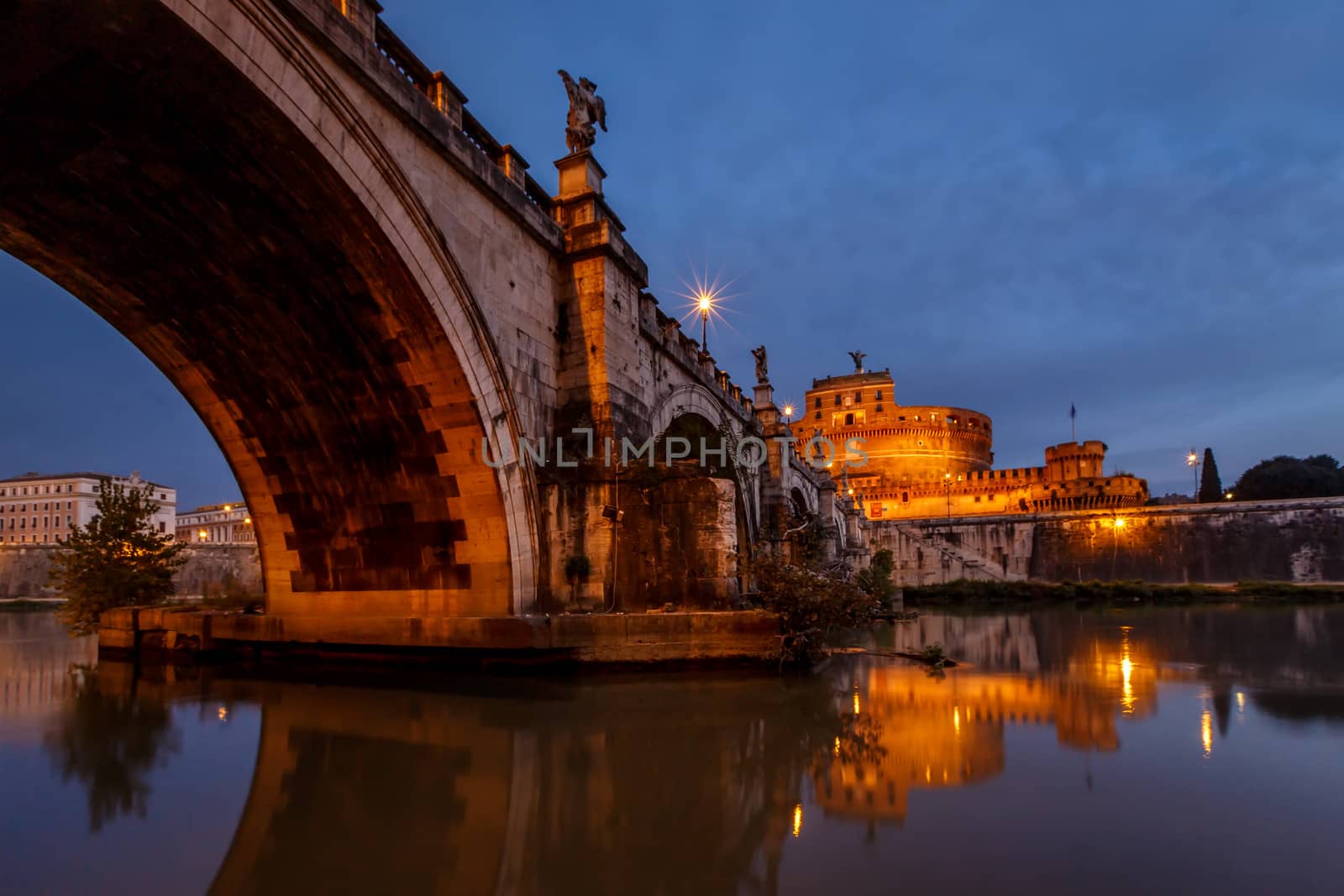 Castle of Holy Angel and Holy Angel Bridge over the Tiber River in Rome at Dawn, Italy