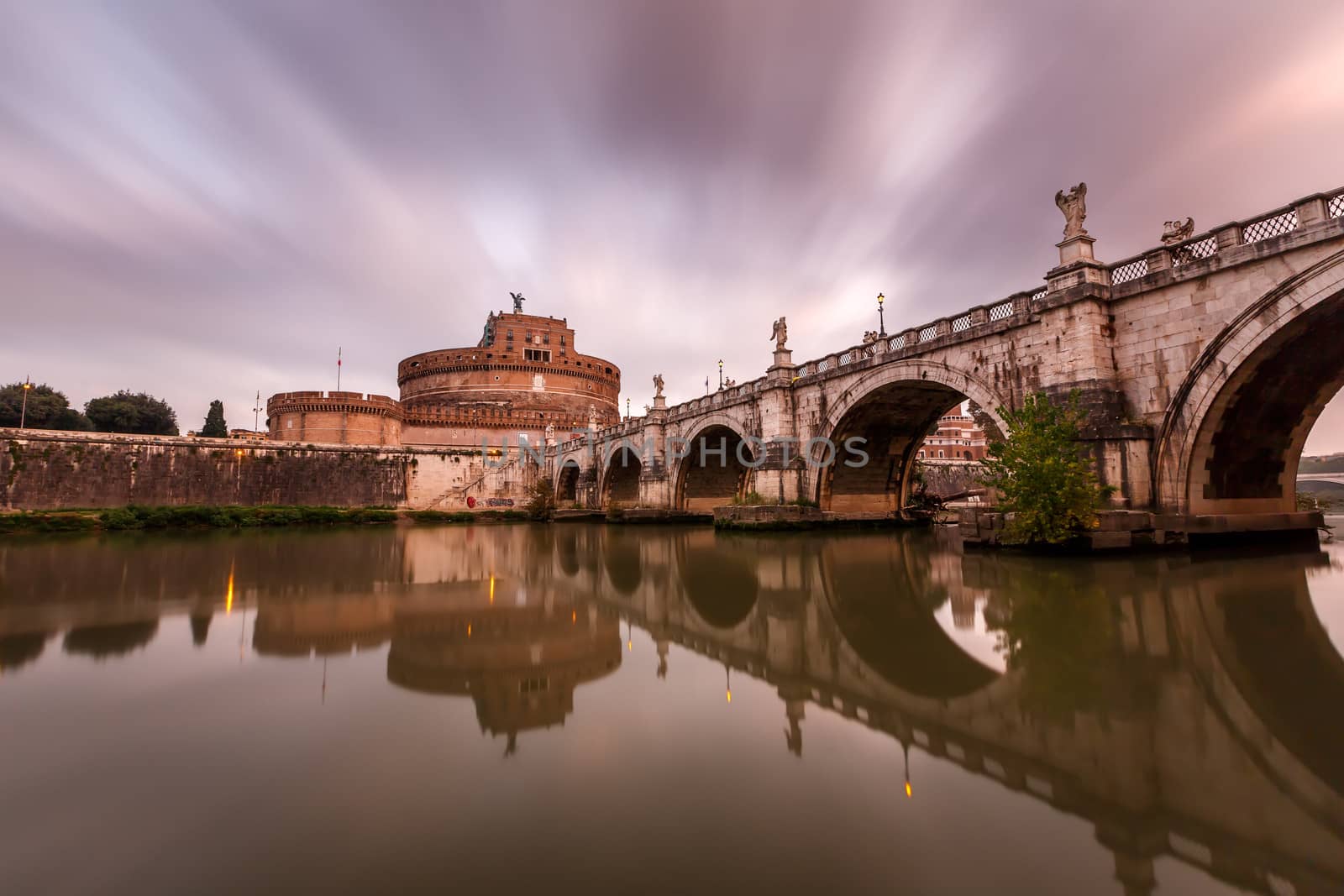 Castle of Holy Angel and Holy Angel Bridge over the Tiber River in Rome at Dawn, Italy