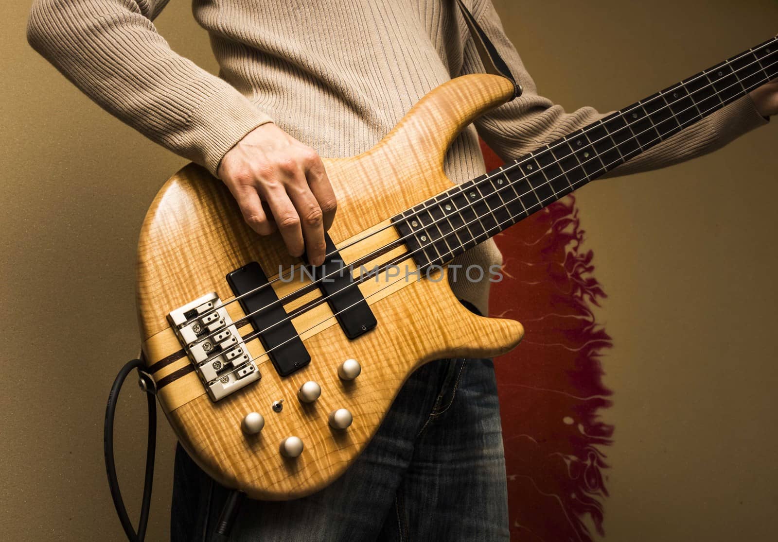 Young man with a bass guitar, front view by snowwhite