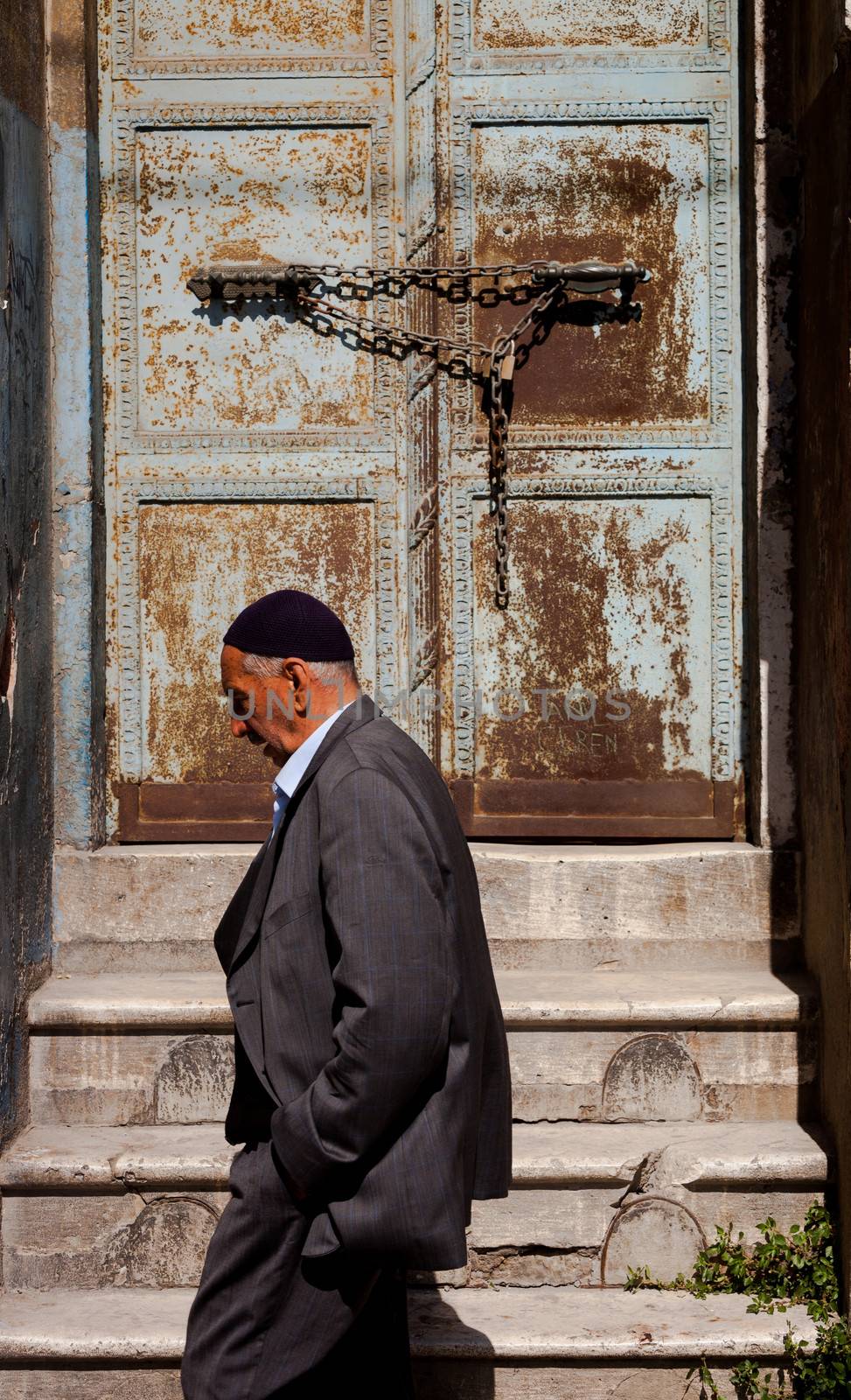 ISTANBUL, TURKEY ��� APRIL 28: Muslim man passing by doorway prior to ANZAC day on April 28, 2012 in Ankara, Turkey.  Each year patriotic Turks honor those fallen at the battle of Galipoli during World War I.