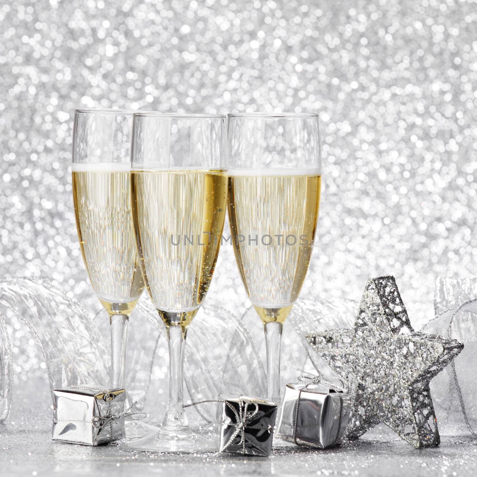 Beautiful silver christmas card with champagne and gift