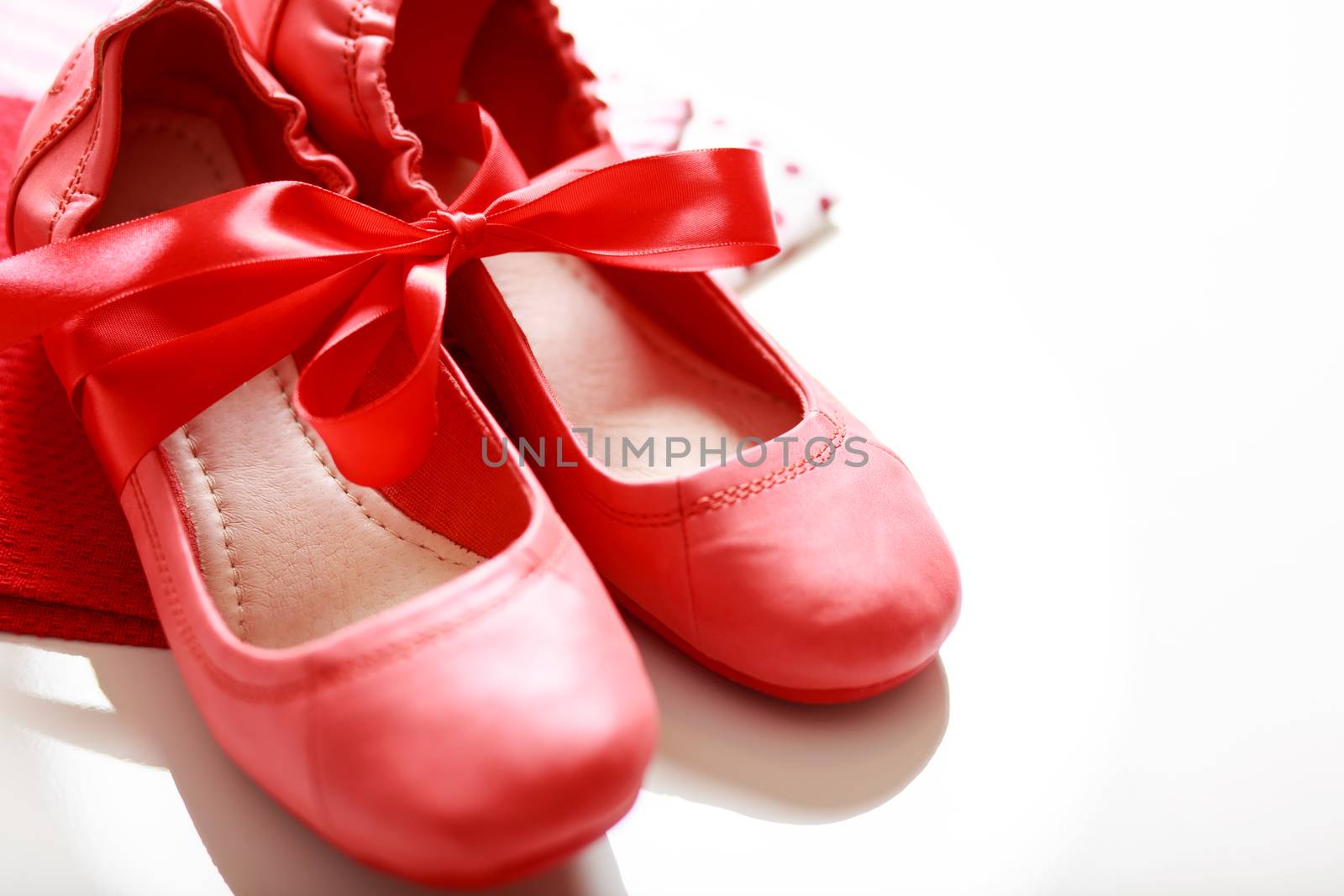 Gift wrapped girls red shoes with ribbon 