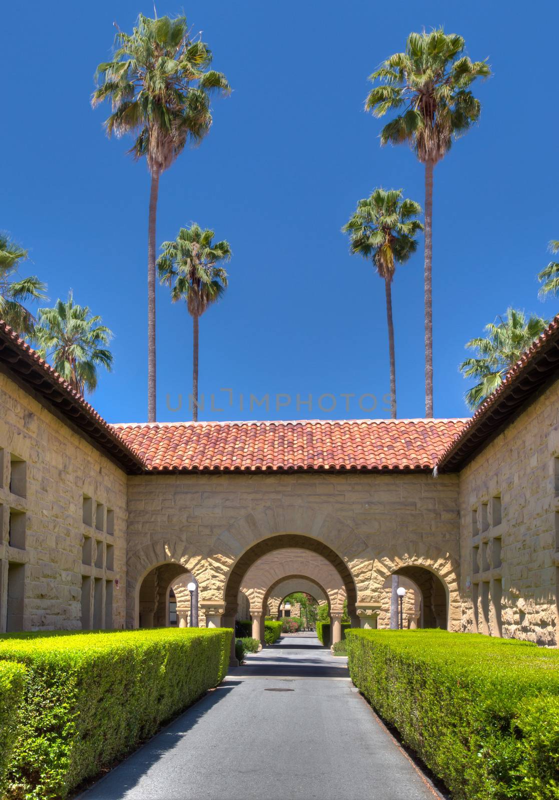 STANFORD, UNITED STATES - July 6: Original walls at Stanford University.  The historic university features original sandstone walls with thick Romanesque features.  July 6, 2013.