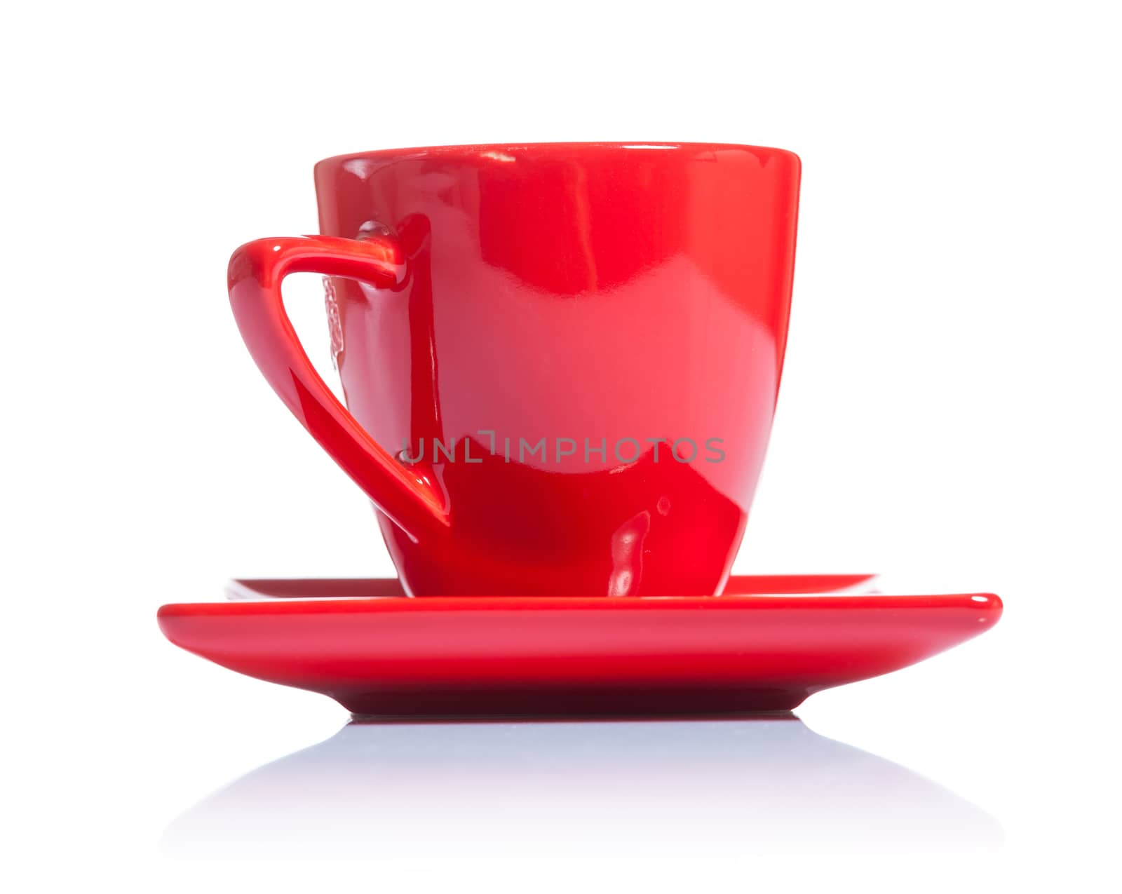 red coffee cup on saucer isolated by mihalec