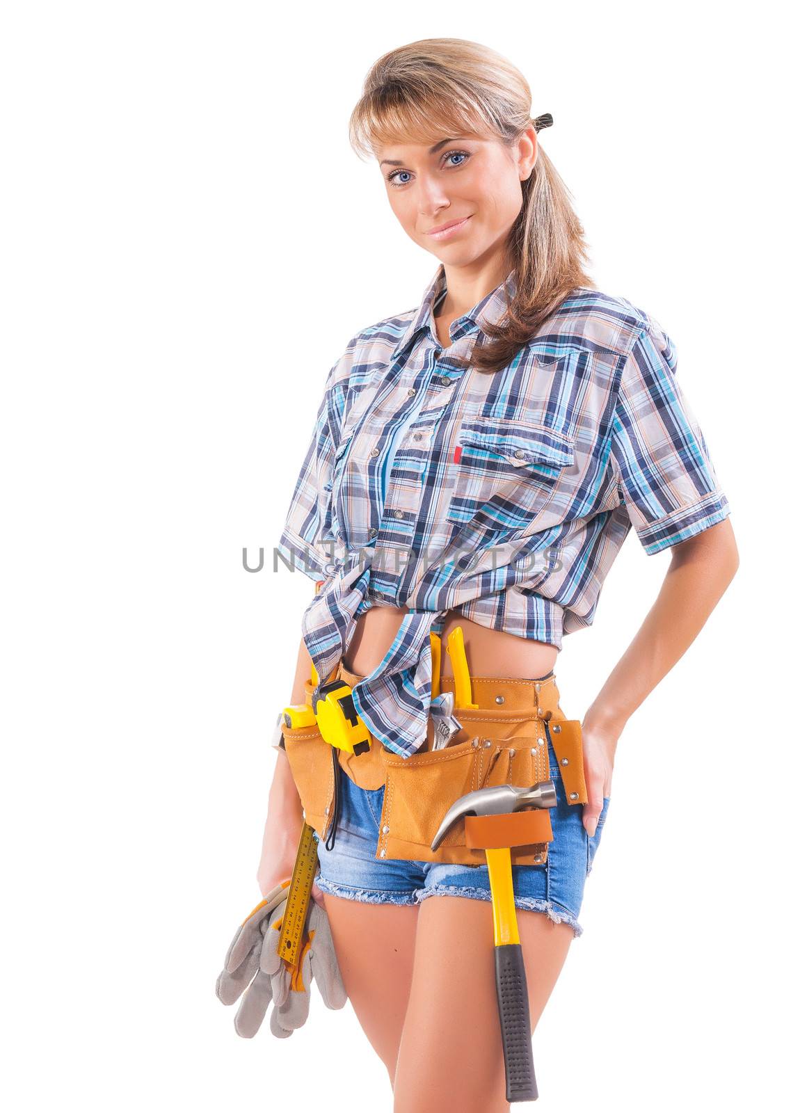 Smiling  sexy young female construction worker isolated on white