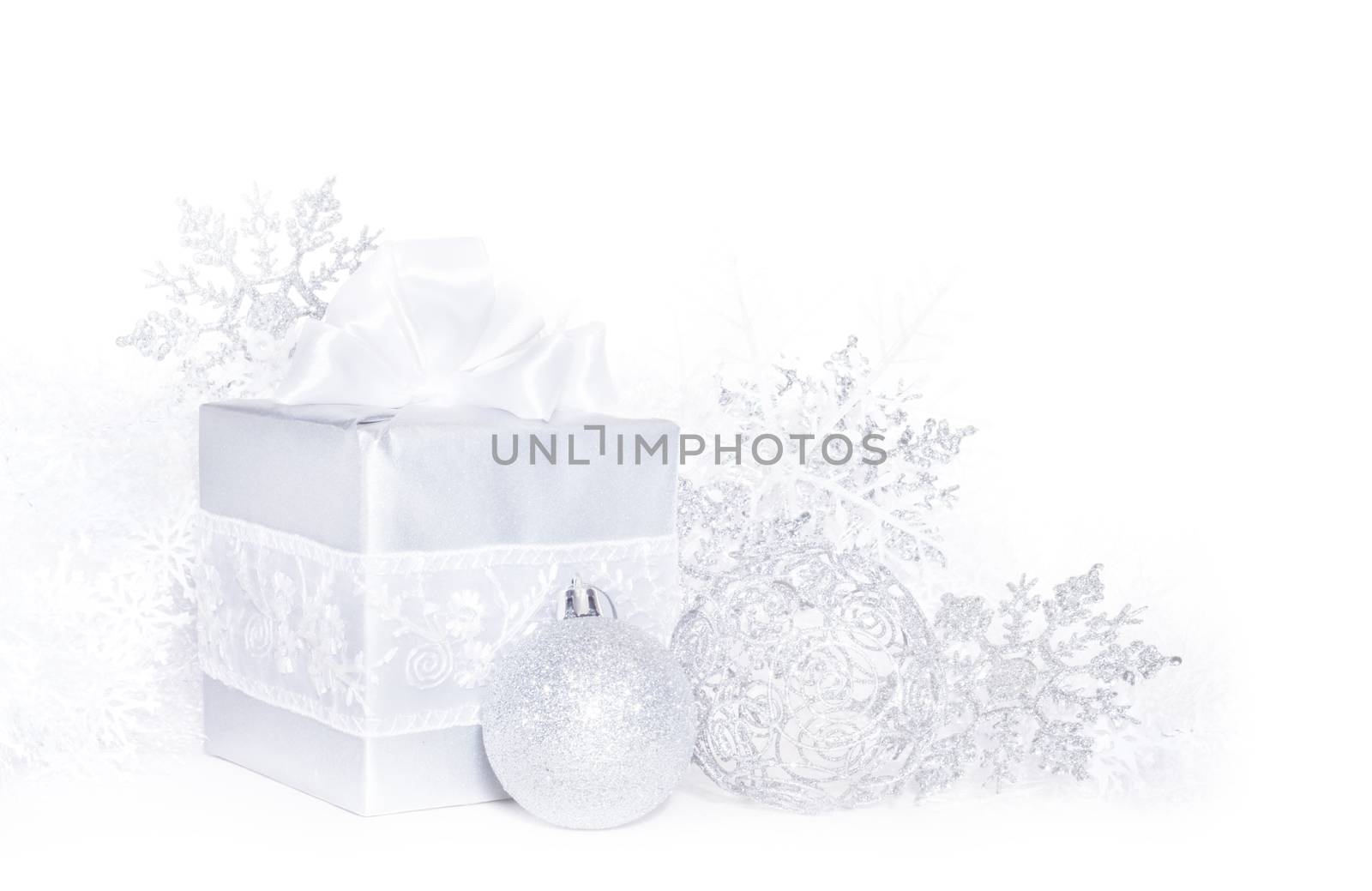 Christmas card with silver gift and decoration on white