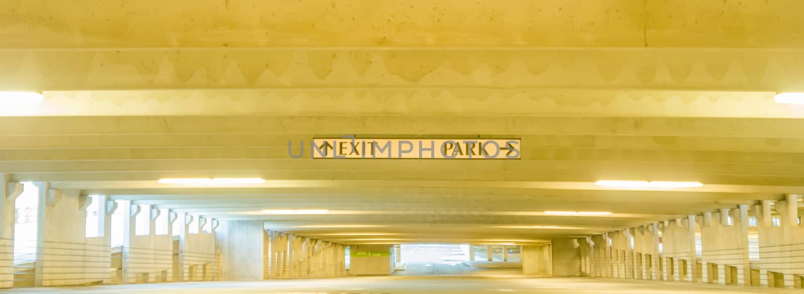 underground parking structure early in the morning without cars