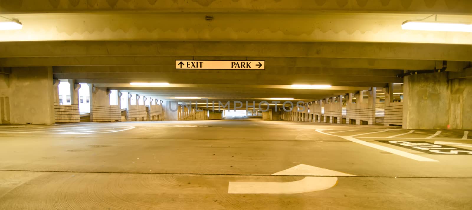 underground parking structure early in the morning without cars