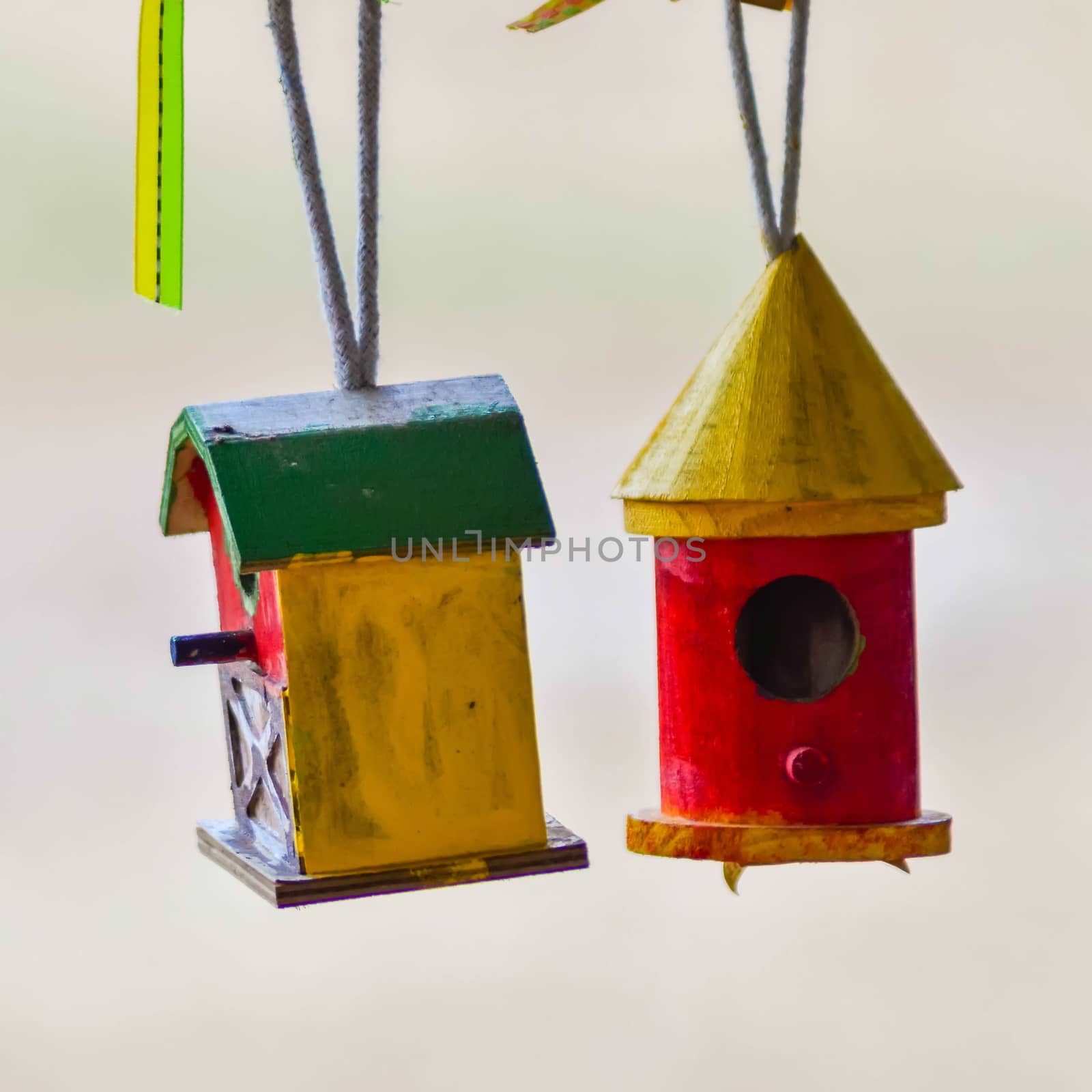 little colorful bird houses on clothes line