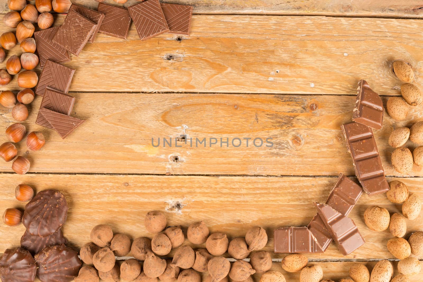 Assorted nuts and sweets on a rustic wooden table