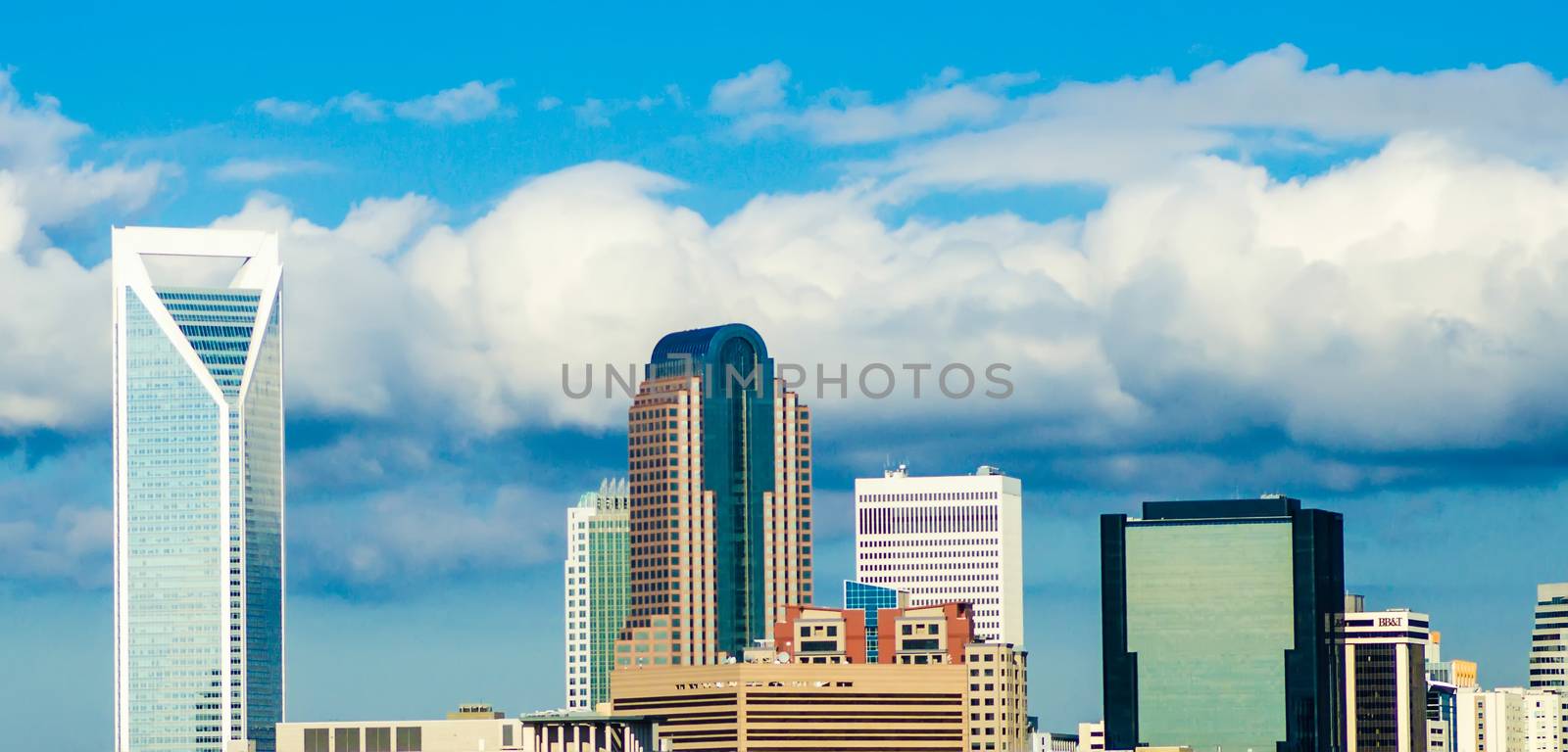 skyline of a modern city - charlotte, north carolina, usa by digidreamgrafix