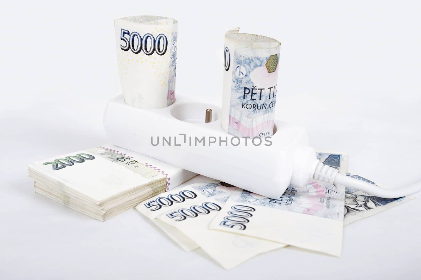 power cord and banknotes of czech crowns money concept of expensive energy bill