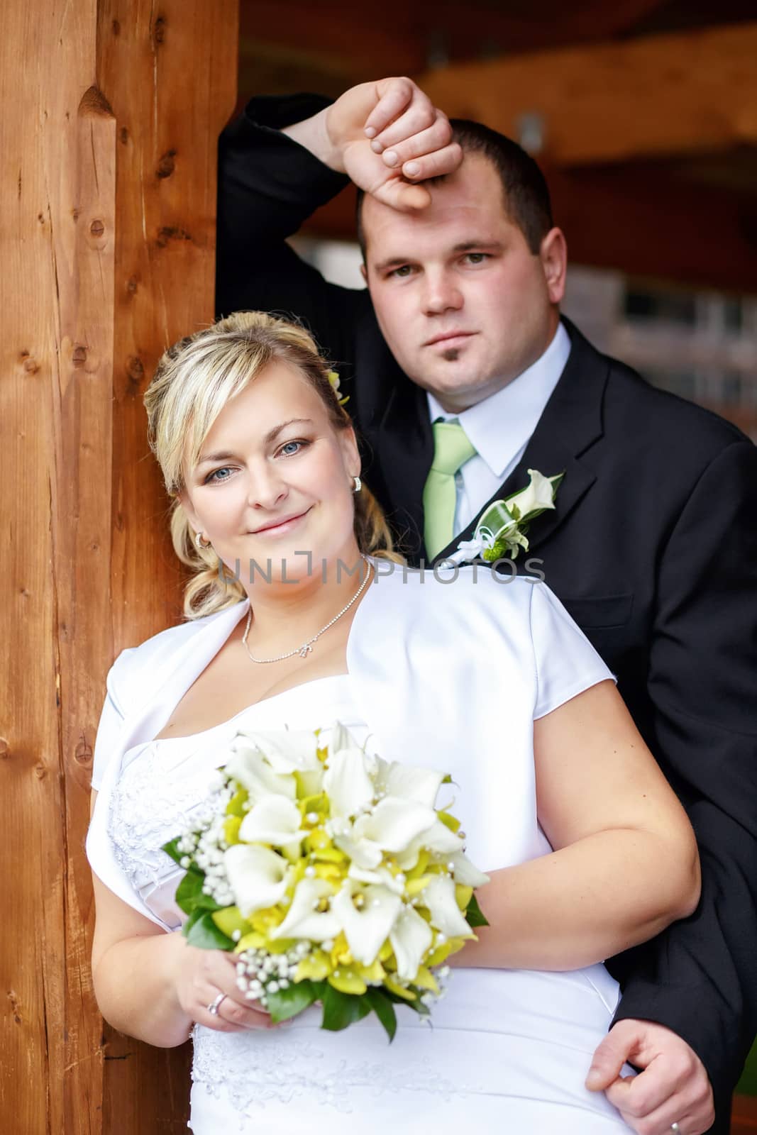 beautiful young wedding couple, bride with her groom
