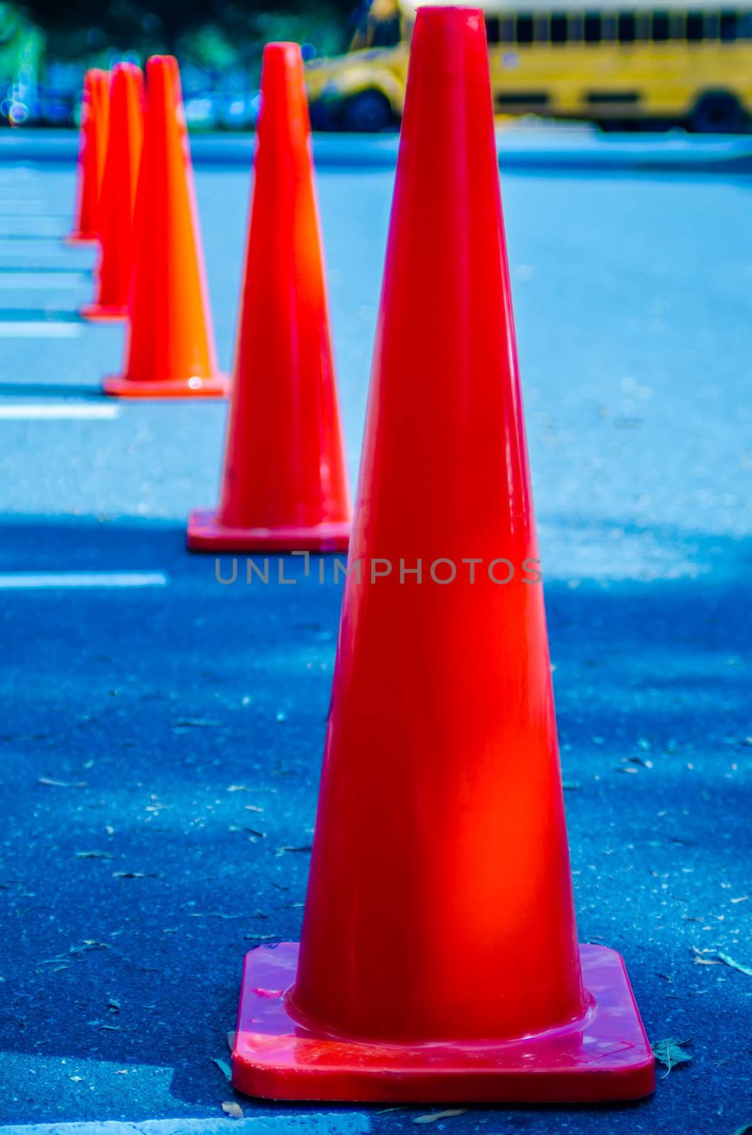 Traffic cones in empty parking space  by digidreamgrafix