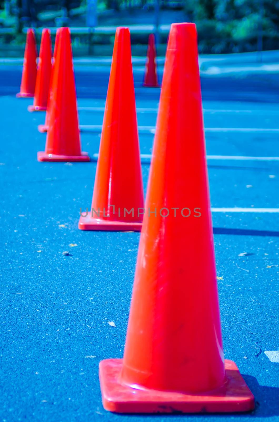 Traffic cones in empty parking space  by digidreamgrafix