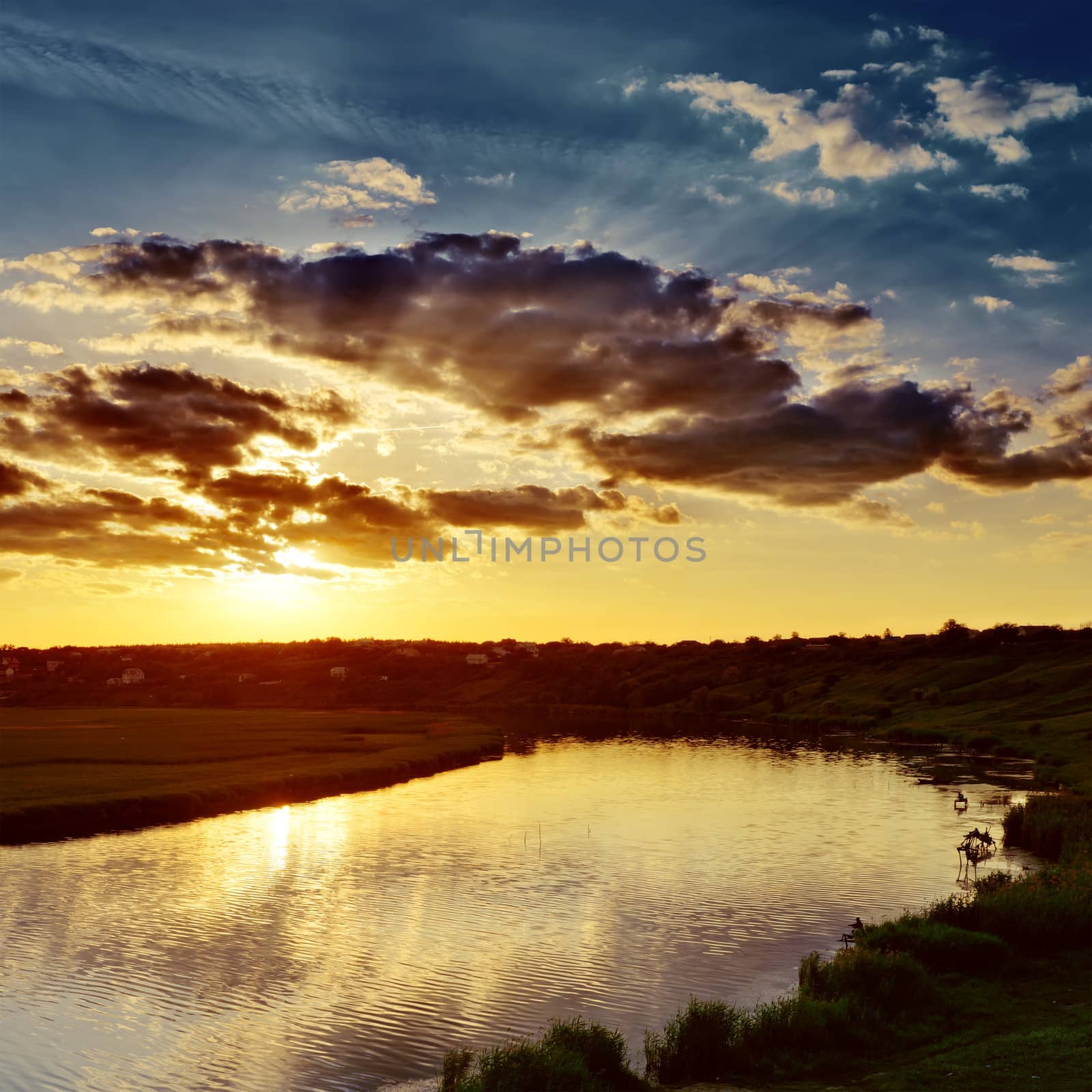 cloudy sunset over river