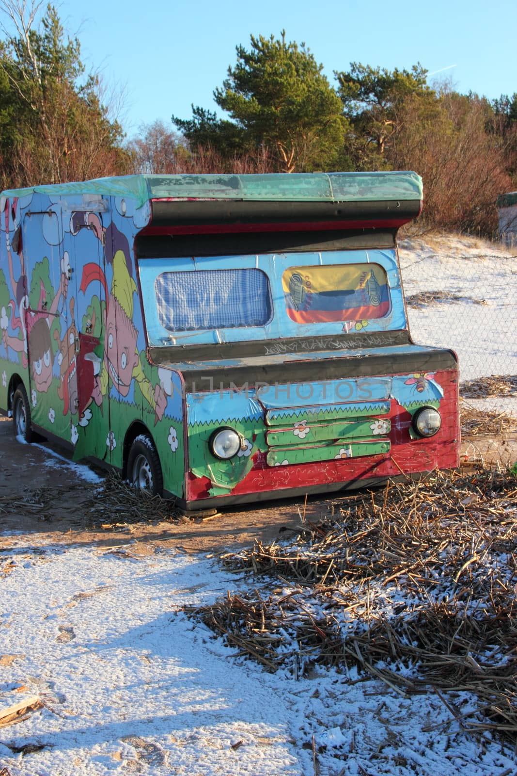 painted car freezer standing on the beach