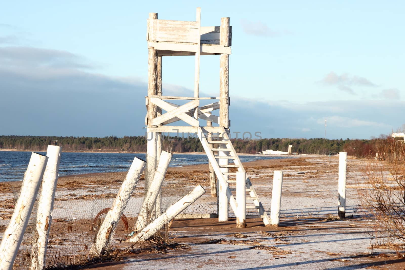 White wooden tower on the beach of Gulf of Finland in St. Petersburg. Russia