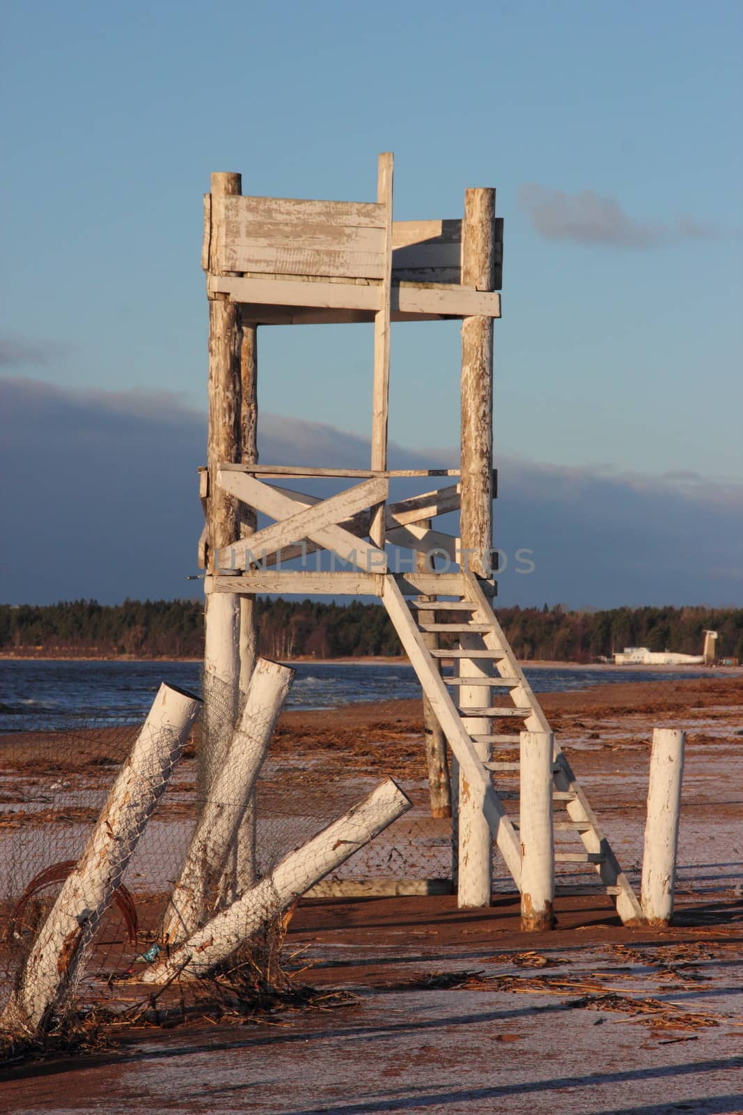 White wooden tower on the beach of Gulf of Finland in St. Petersburg. Russia