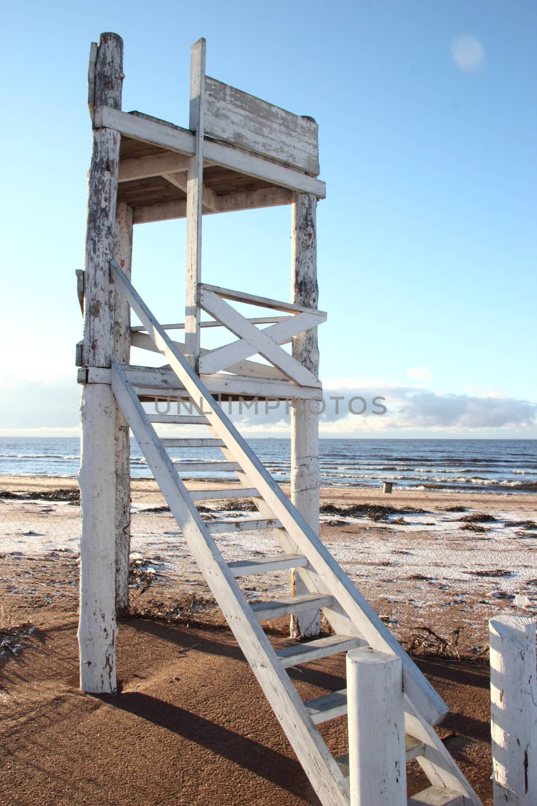 White wooden tower on the beach of Gulf of Finland in St. Petersburg. Russia