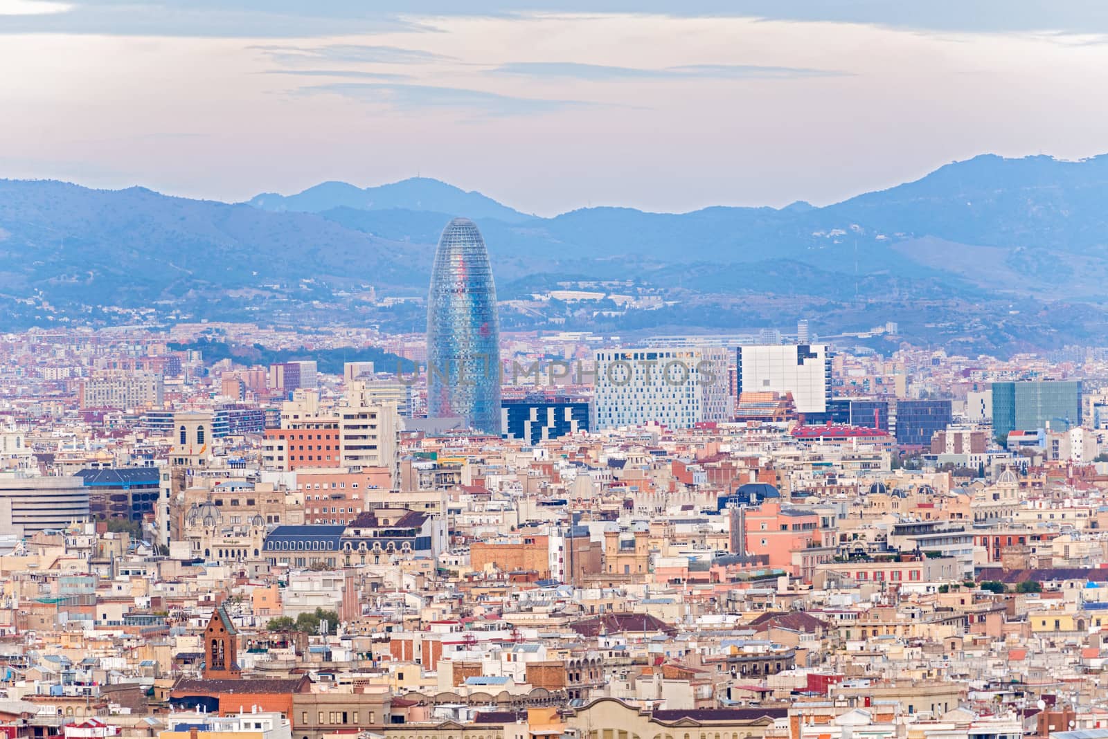 Barcelona, Spain - November 23: Aerial view at Barcelona on November 23, 2013. Famous Barcelona The Torre Agbar, Water Department Tower at the background.