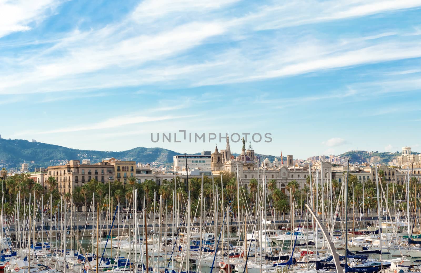 Barcelona, Spain - October 12: City of Barcelona landscape and sail boats in Port Vell.  Port Vell is a waterfront harbour in Barcelona, Catalonia, Spain, and part of the Port of Barcelona. It was built as part of an urban renewal program prior to the 1992 Barcelona Olympics. 