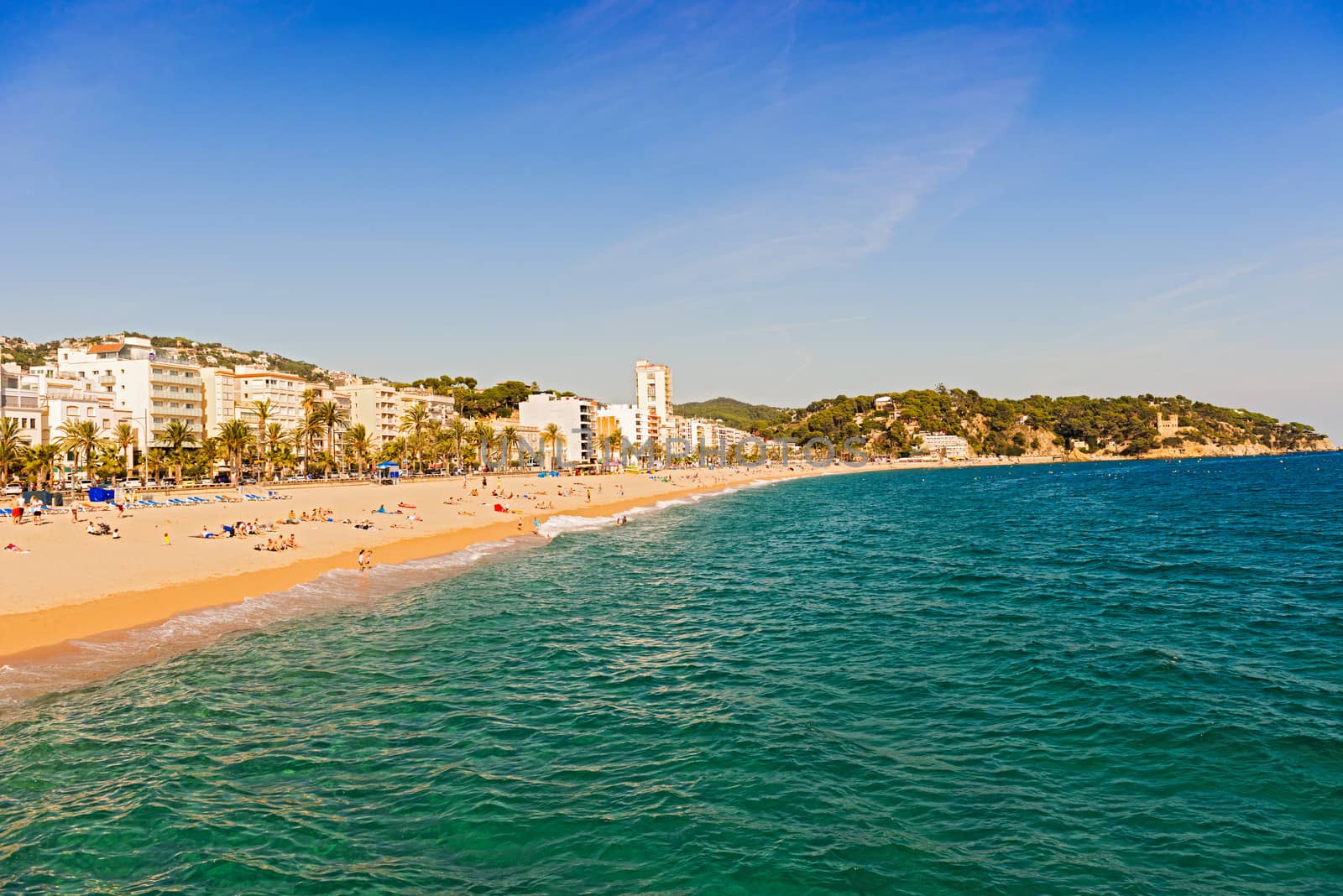 Lloret de Mar, Spain - October 13: Tourists enjoy beach in Lloret de Mar on Costa Brava shores on October 13, 2013