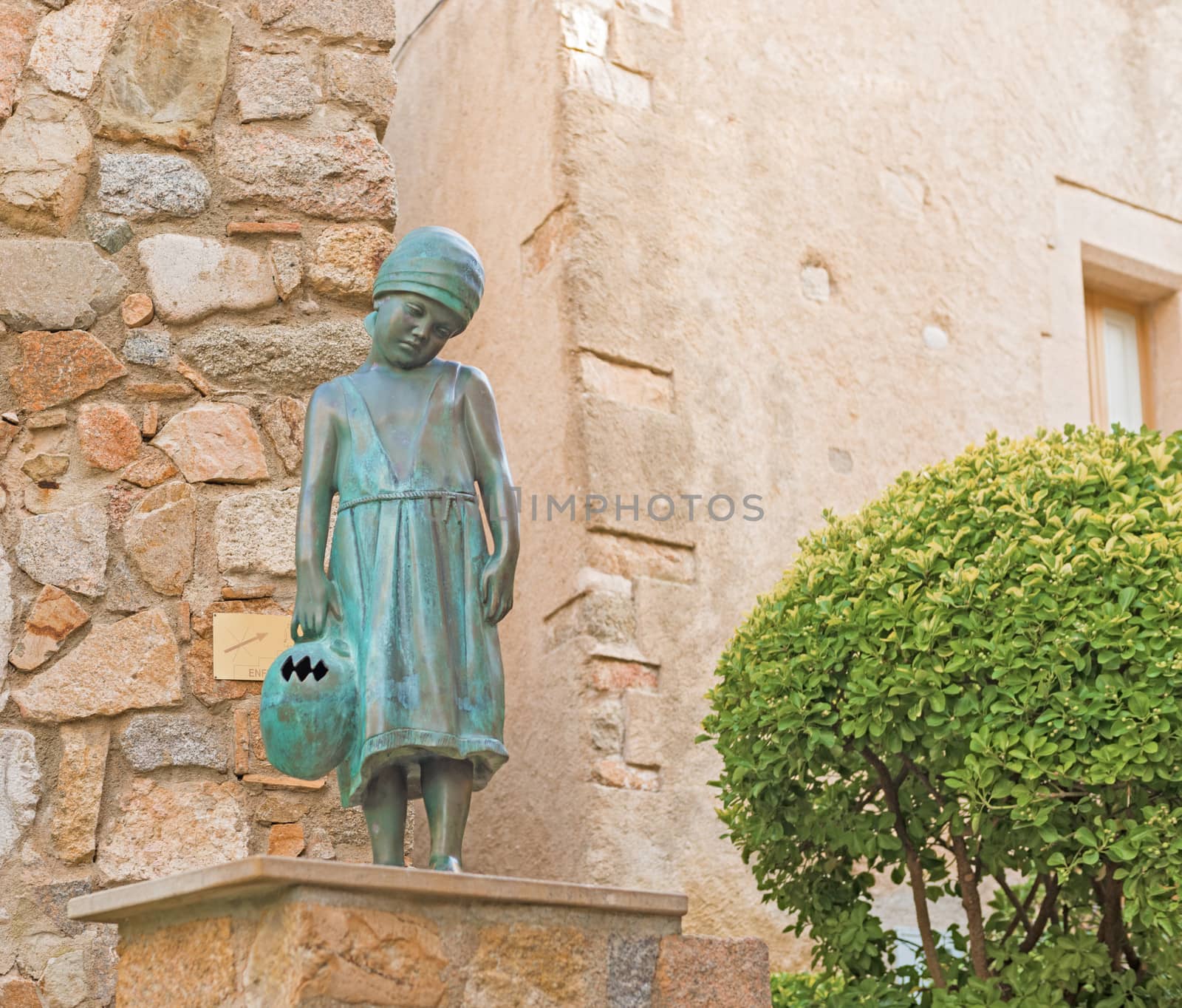 Girl Statue on the street in medievaltown of Tossa del Mar on Costa Brava, Spain