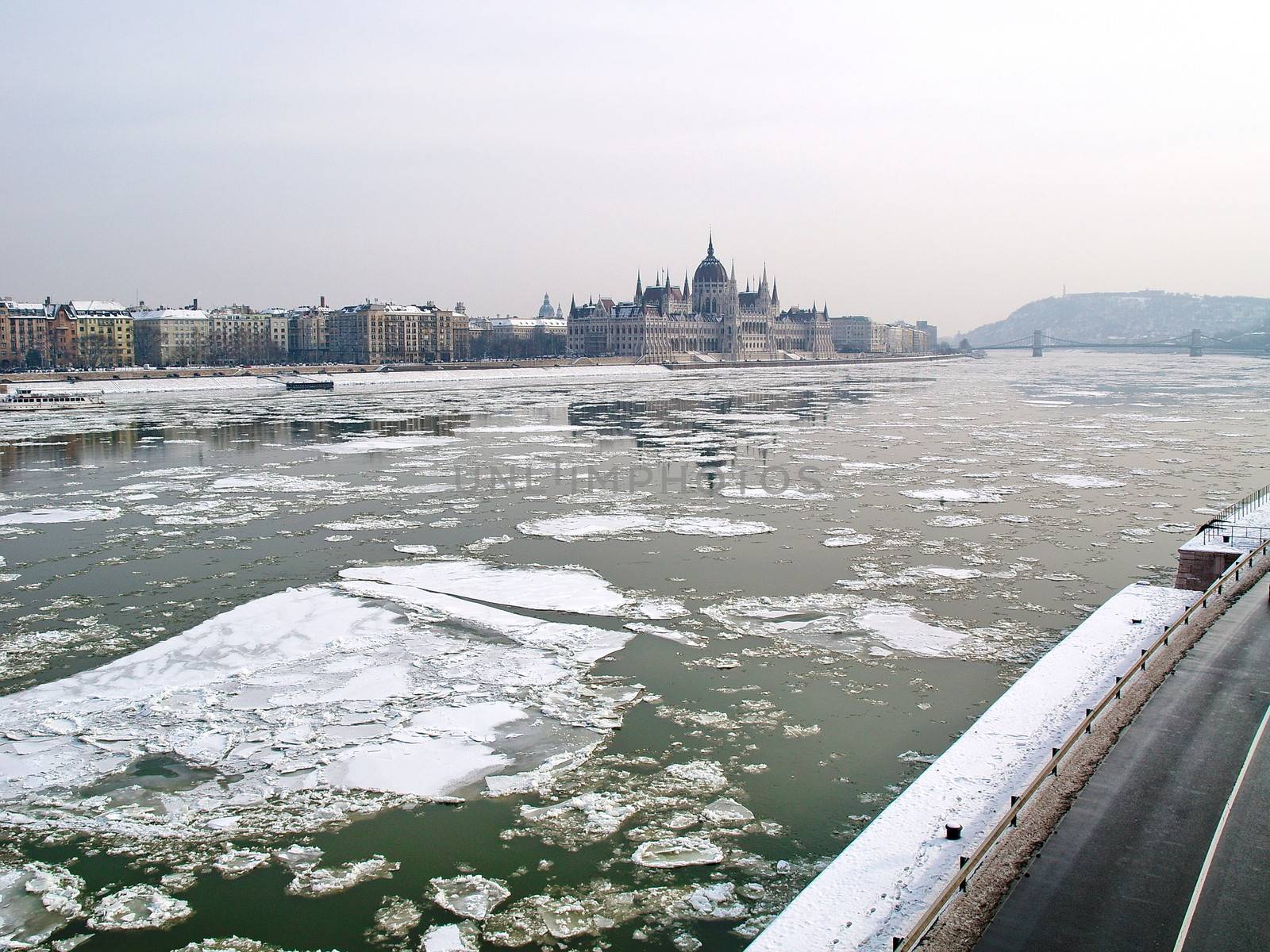 Parliament of Hungary and the icey river of Danube by anderm