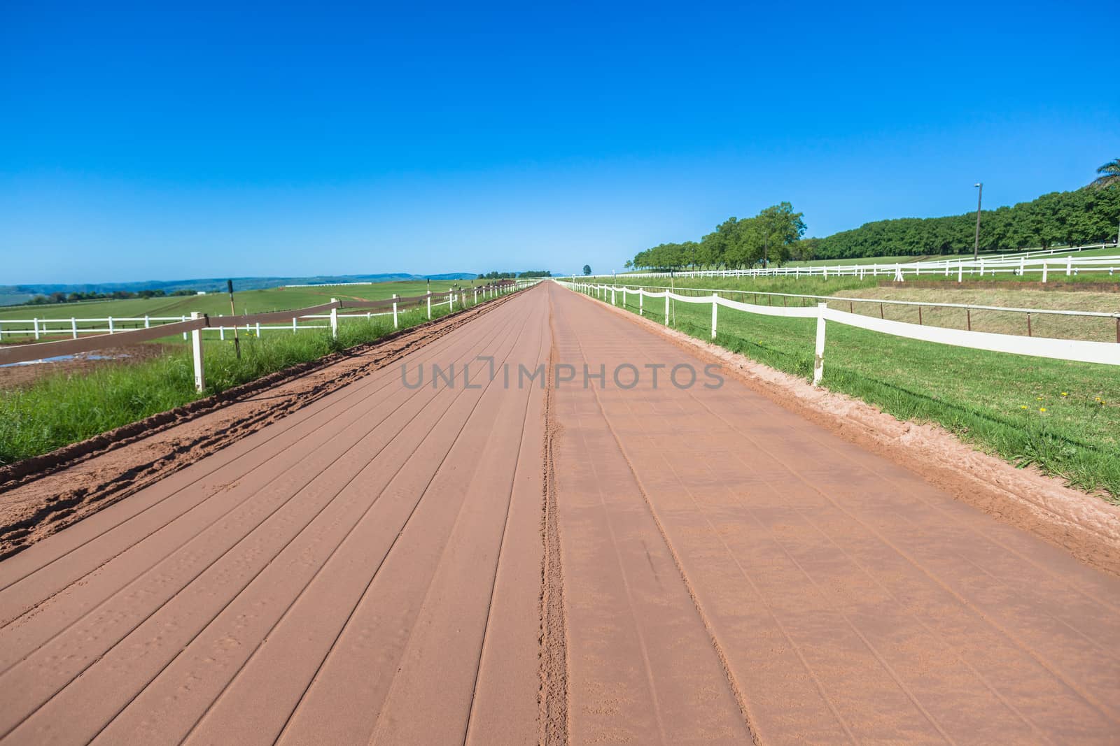 Smooth Sand Track straight with fence railing for race horses training