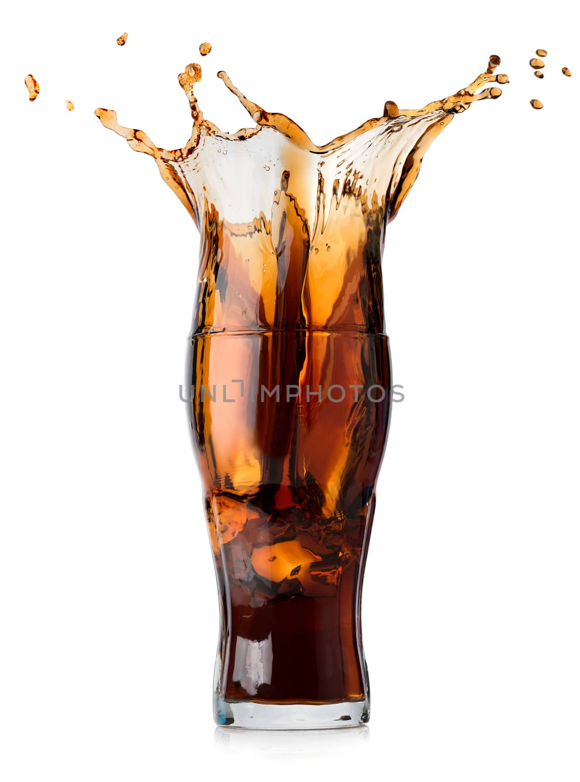 Splash of cola in a glass isolated on a white background