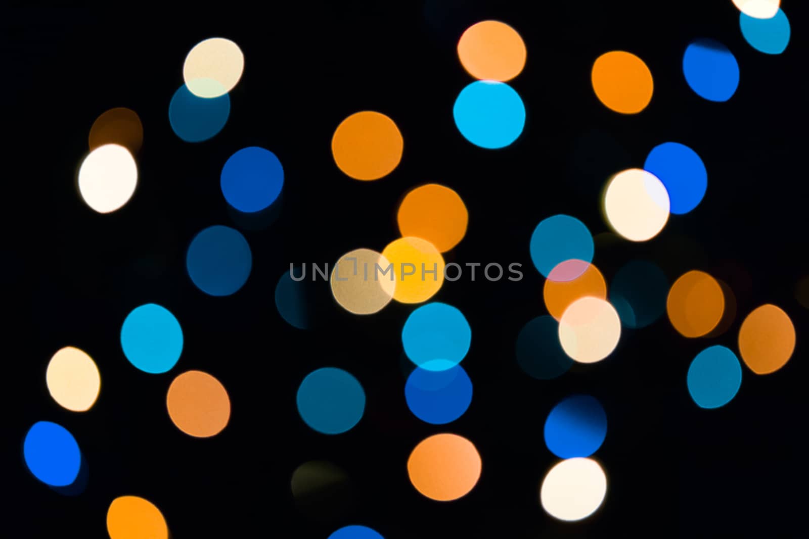 Blue and orange natural bokeh texture on dark background