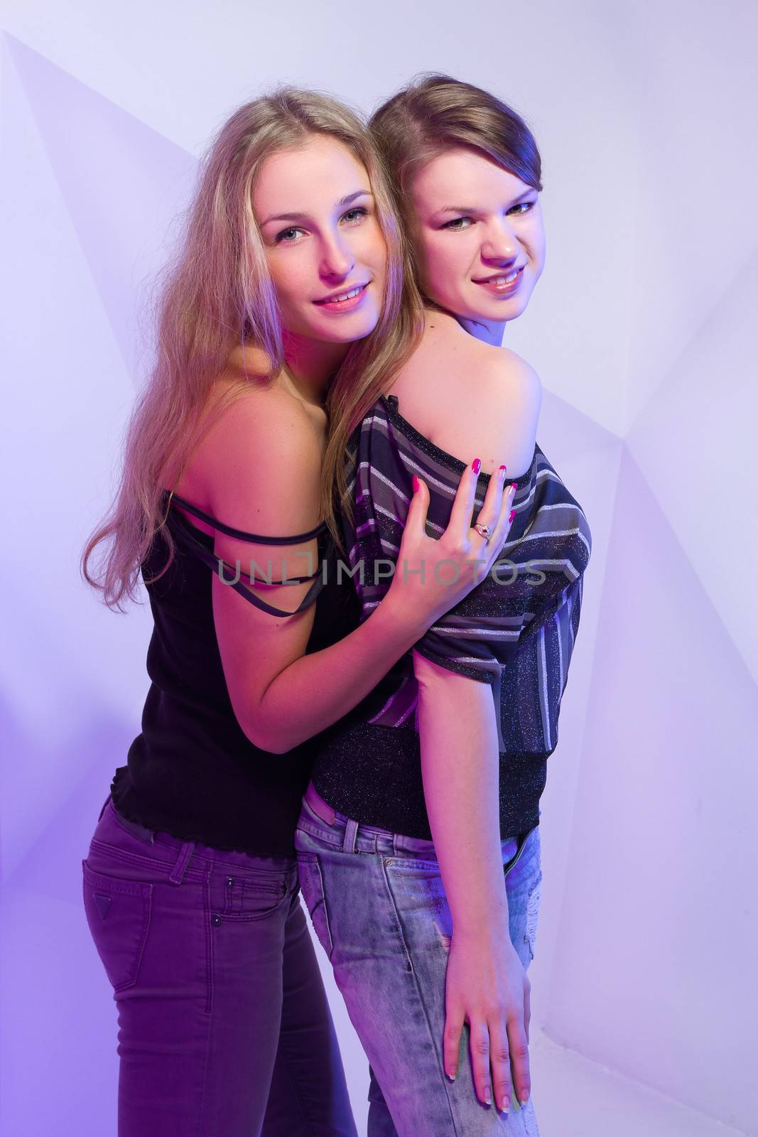 Portrait of two dancing girls on disco party