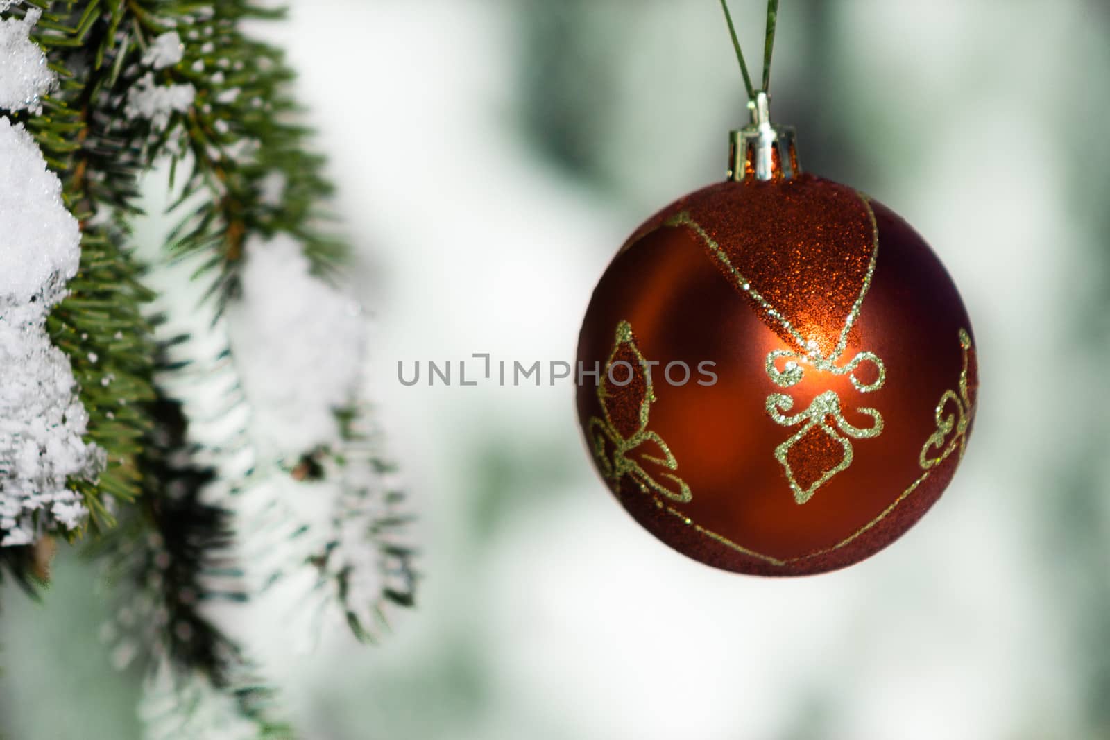 Christmas decoration hanging on tree with snow