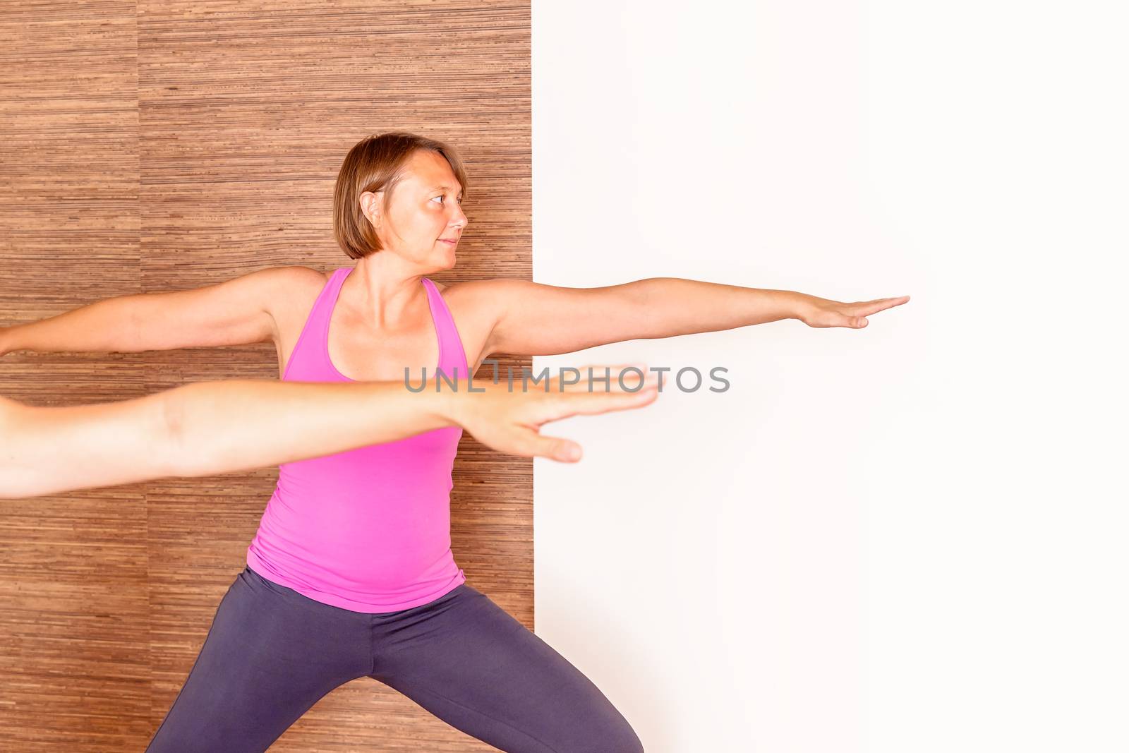 An image of a pretty woman doing yoga at home -