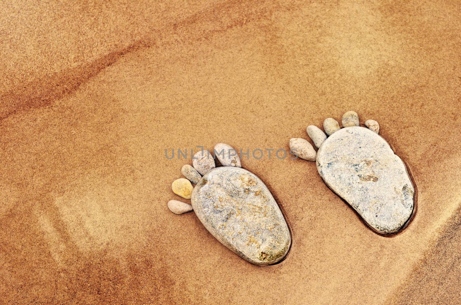 Stone traces of the pebbles on a sandy beach