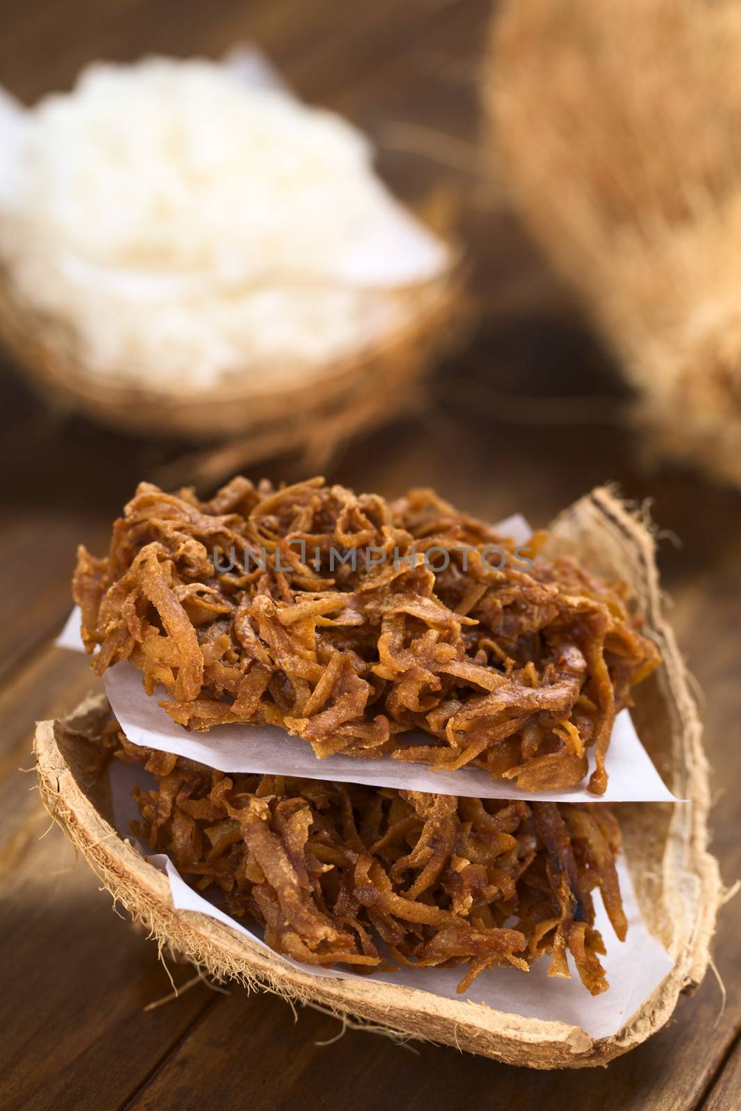 Peruvian cocadas, a traditional coconut dessert sold usually on the streets, made of grated coconut and white or brown sugar, which gives the different coloring of the sweet (Selective Focus, Focus on the front of the cocadas)