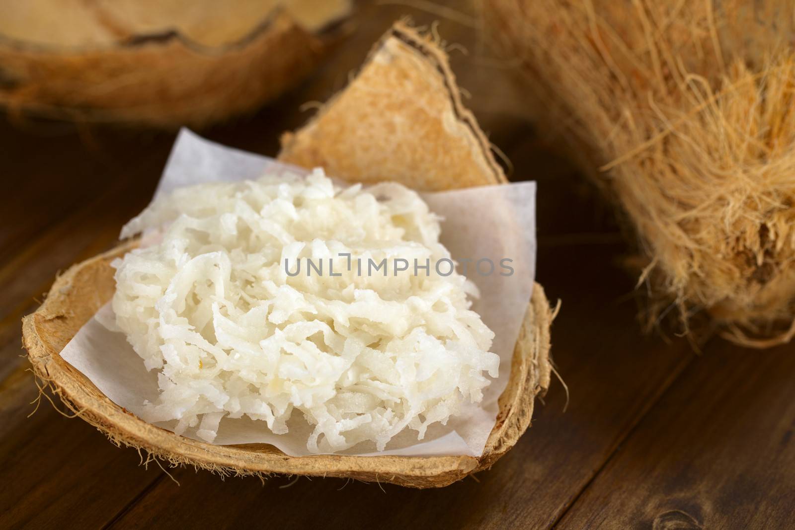 Peruvian cocada, a traditional coconut dessert sold usually on the streets, made of grated coconut and granulated white sugar (Selective Focus, Focus one third ino the cocada)