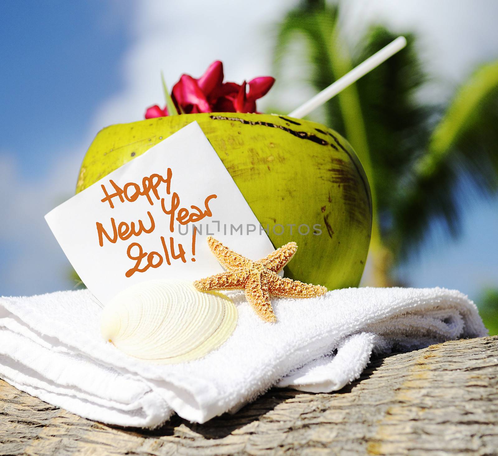 Coconut cocktail starfish tropical Caribbean beach refreshment and towel