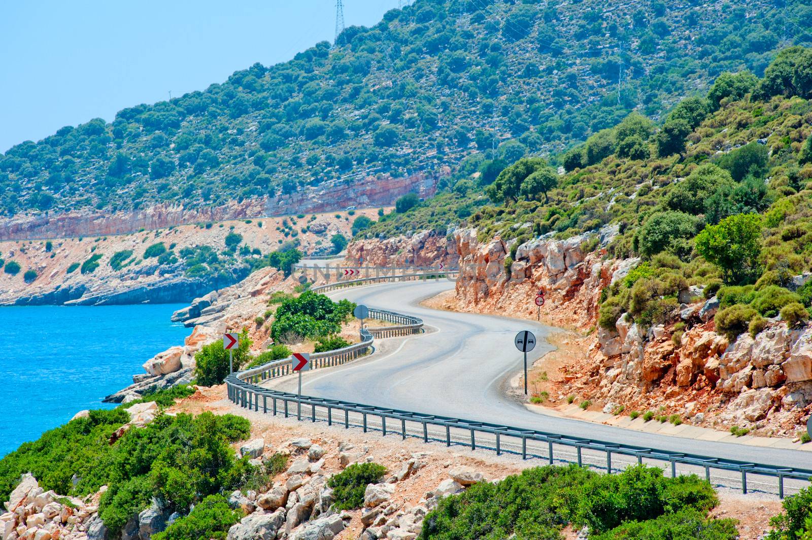 winding road in the mountains leads to the sea