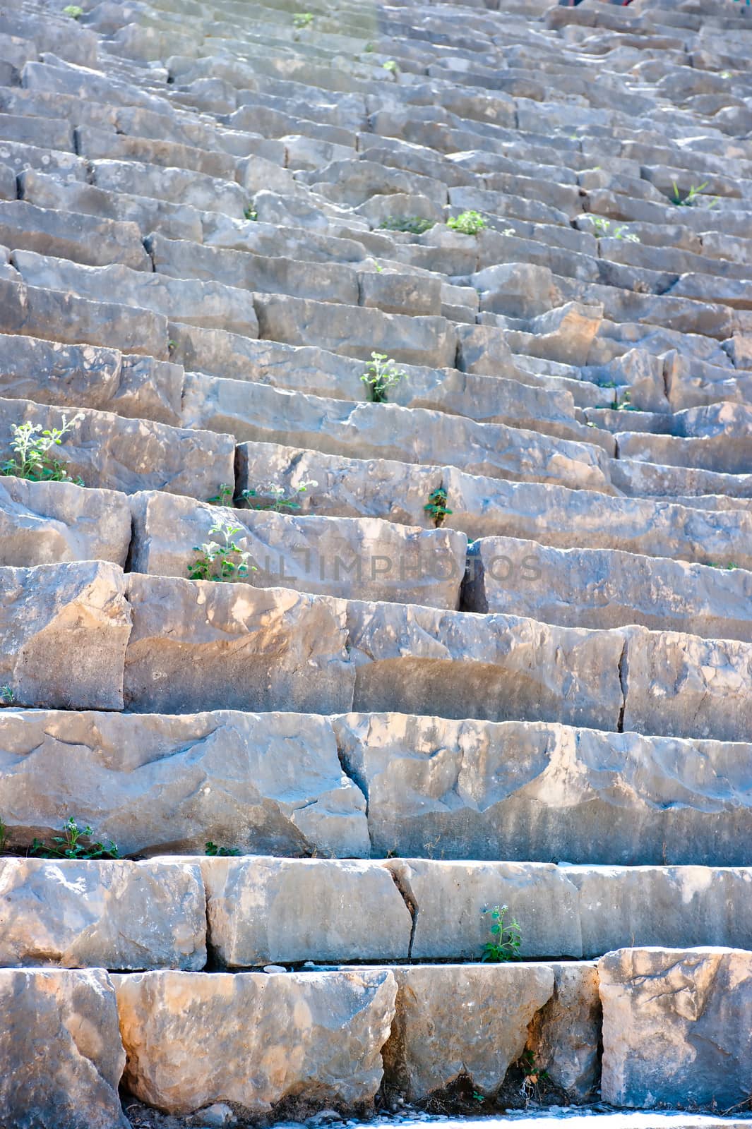 ruined stone steps of the ancient Roman theater by kosmsos111