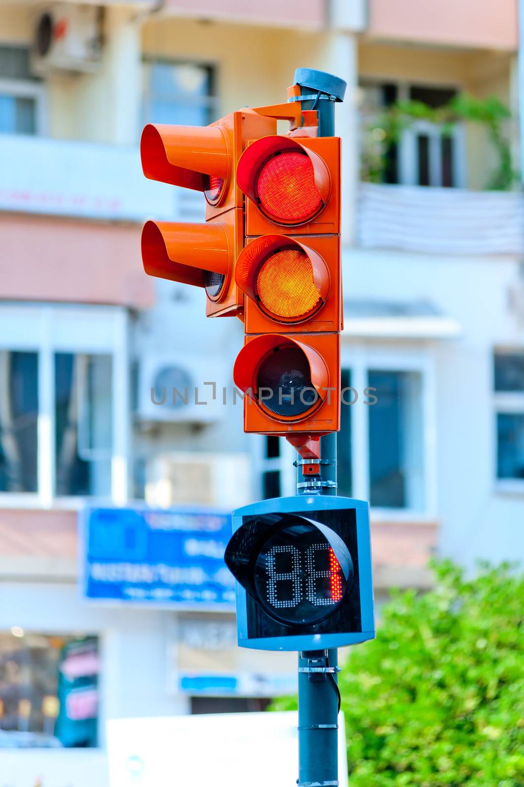 traffic light on the background of a city street by kosmsos111
