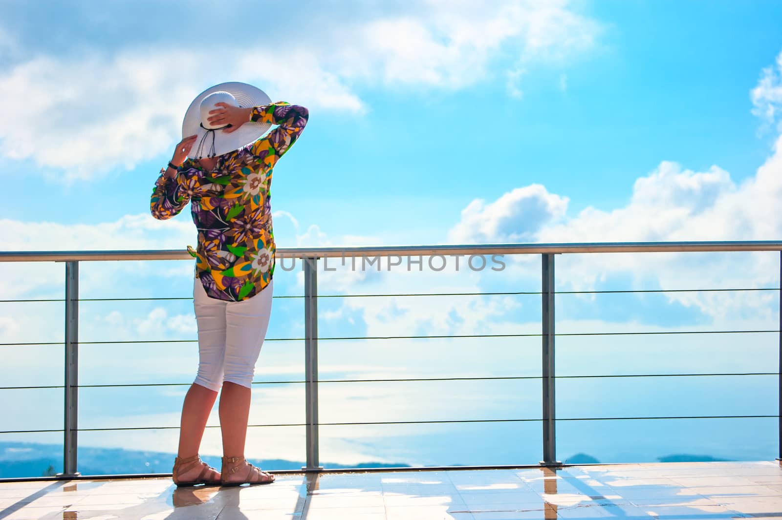 woman enjoys the view from the heights