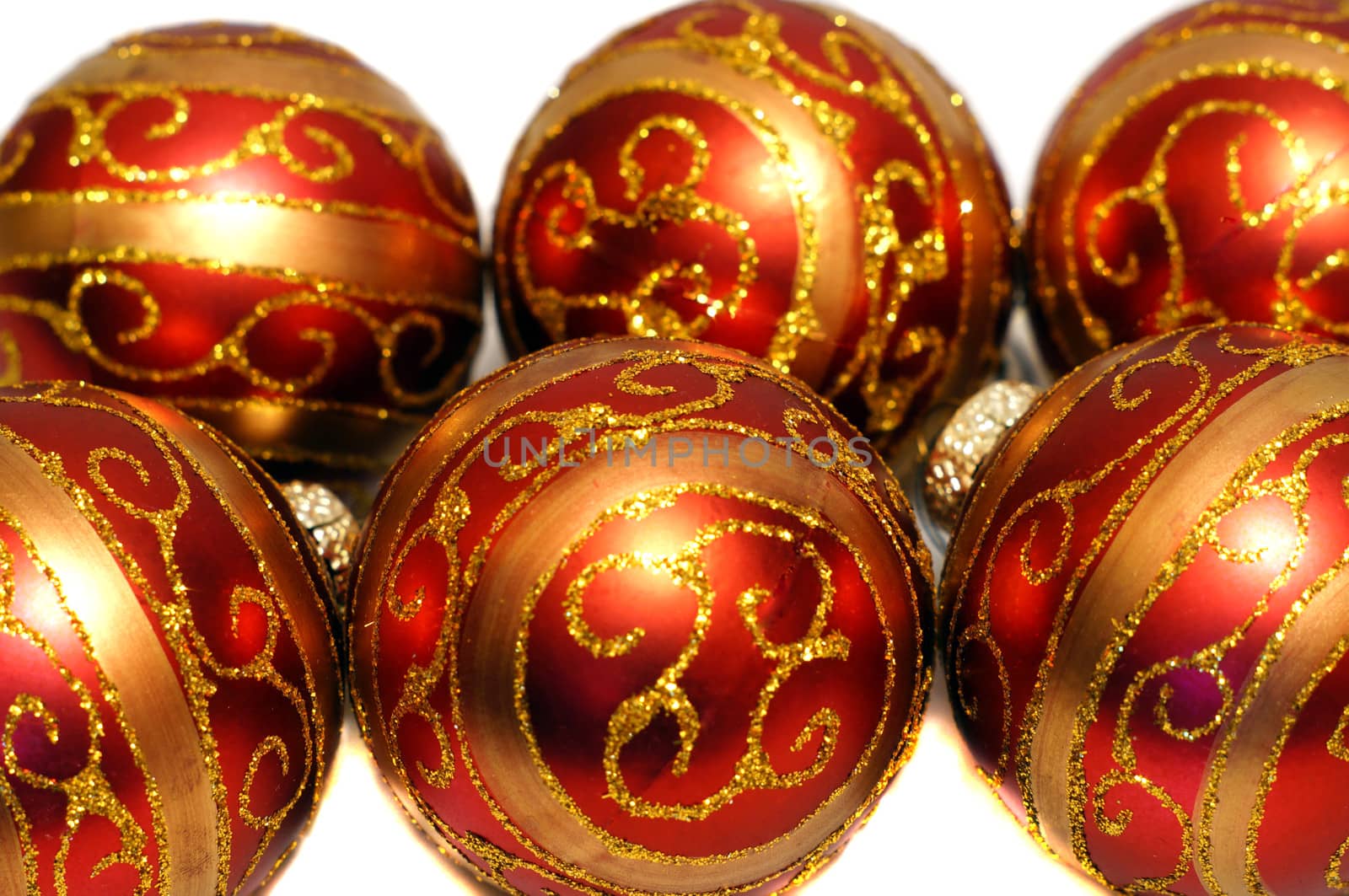 Composition of red Christmas balls with golden pattern