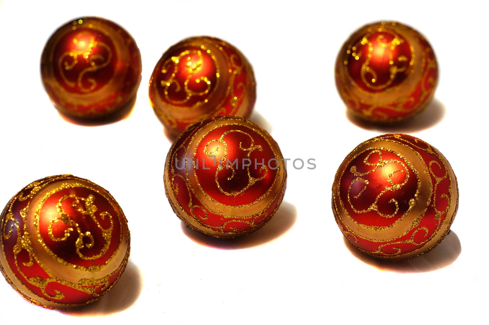 Composition of red Christmas balls with golden pattern