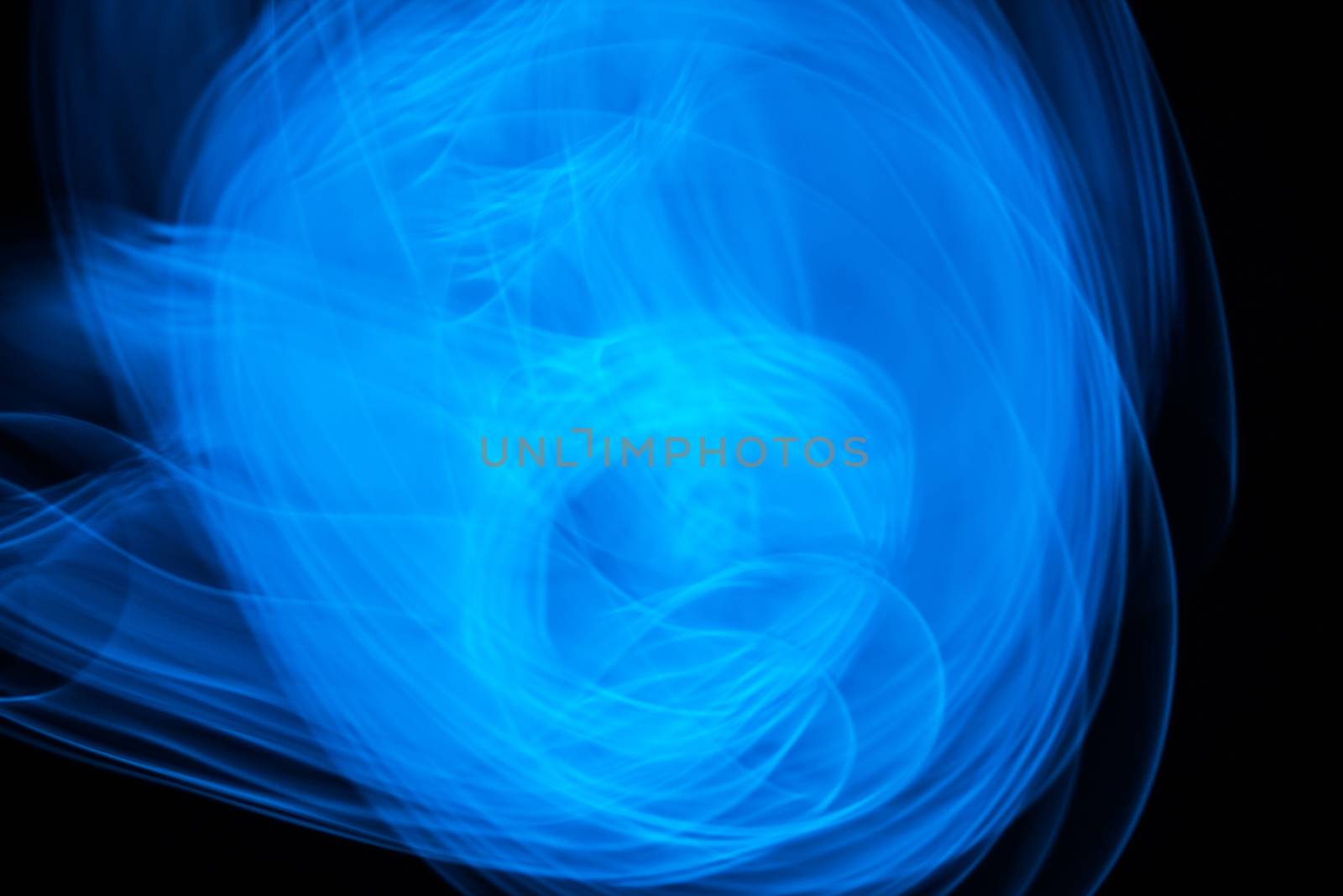 Curved bluish lines. Abstract forms of light in long exposure.