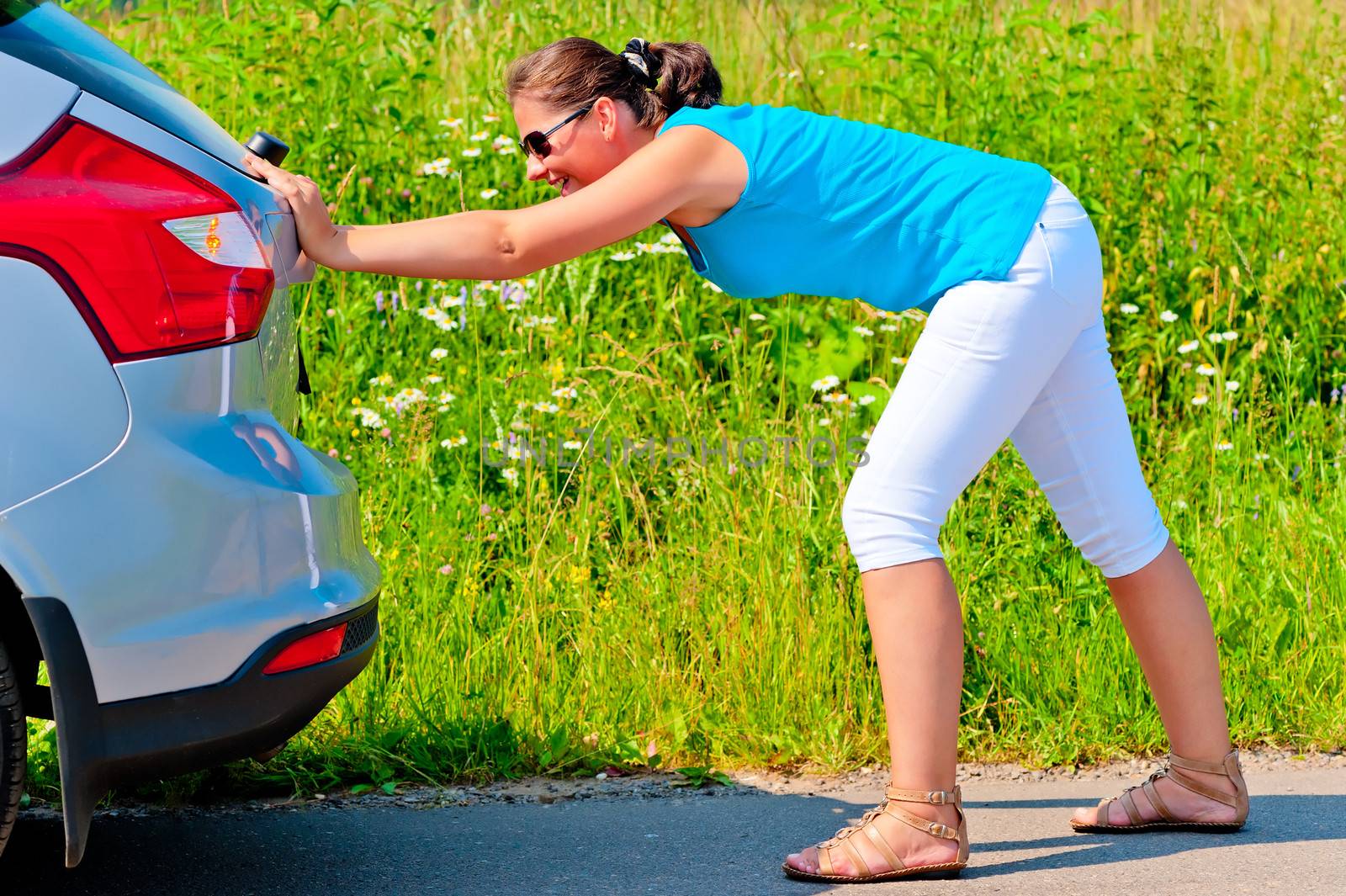 woman pushing car out of gasoline by kosmsos111